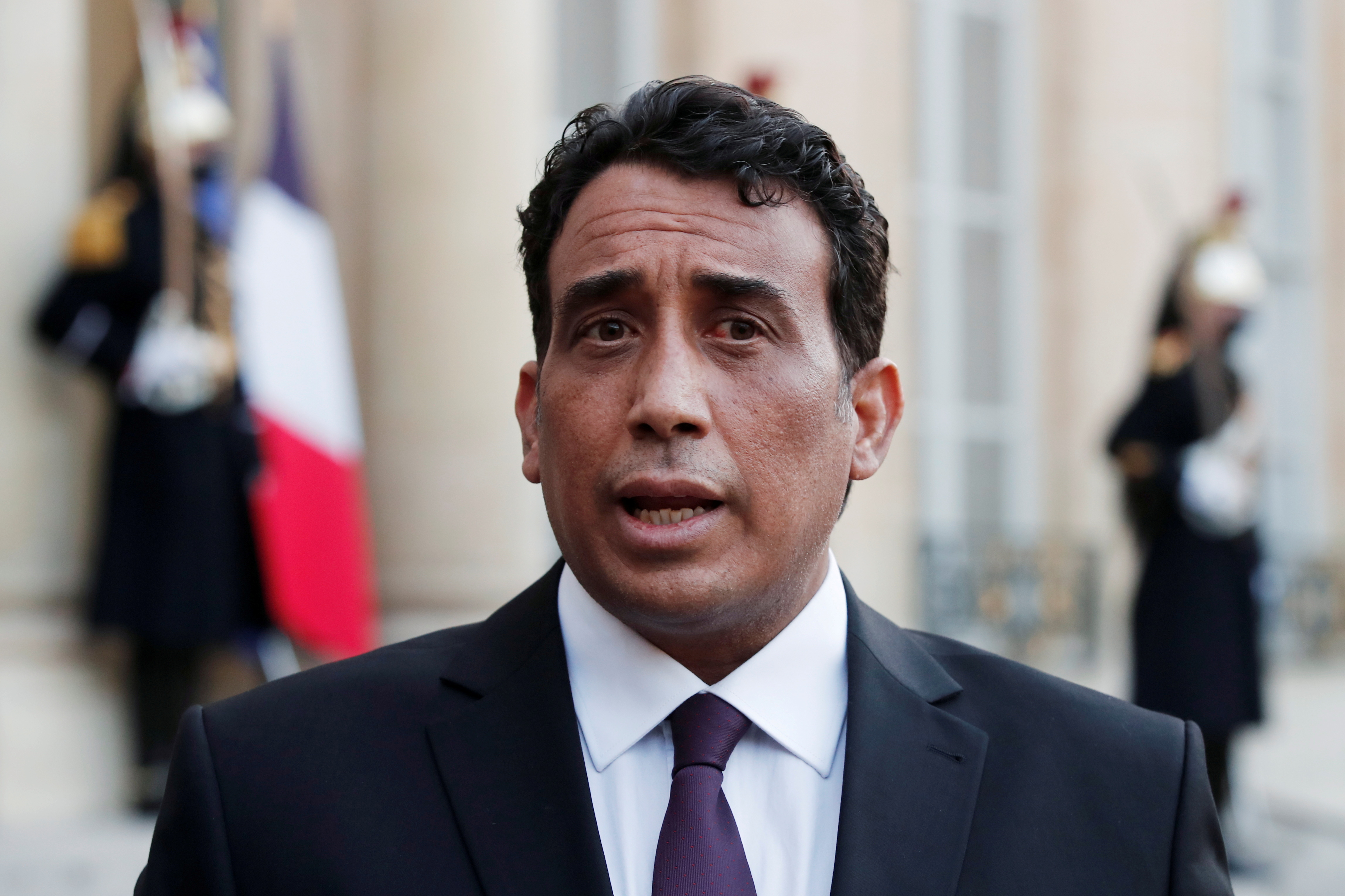 Mohamed al-Menfi, Head of the Presidential Council of Libya, talks to media after a meeting with the French President at the Elysee Palace in Paris