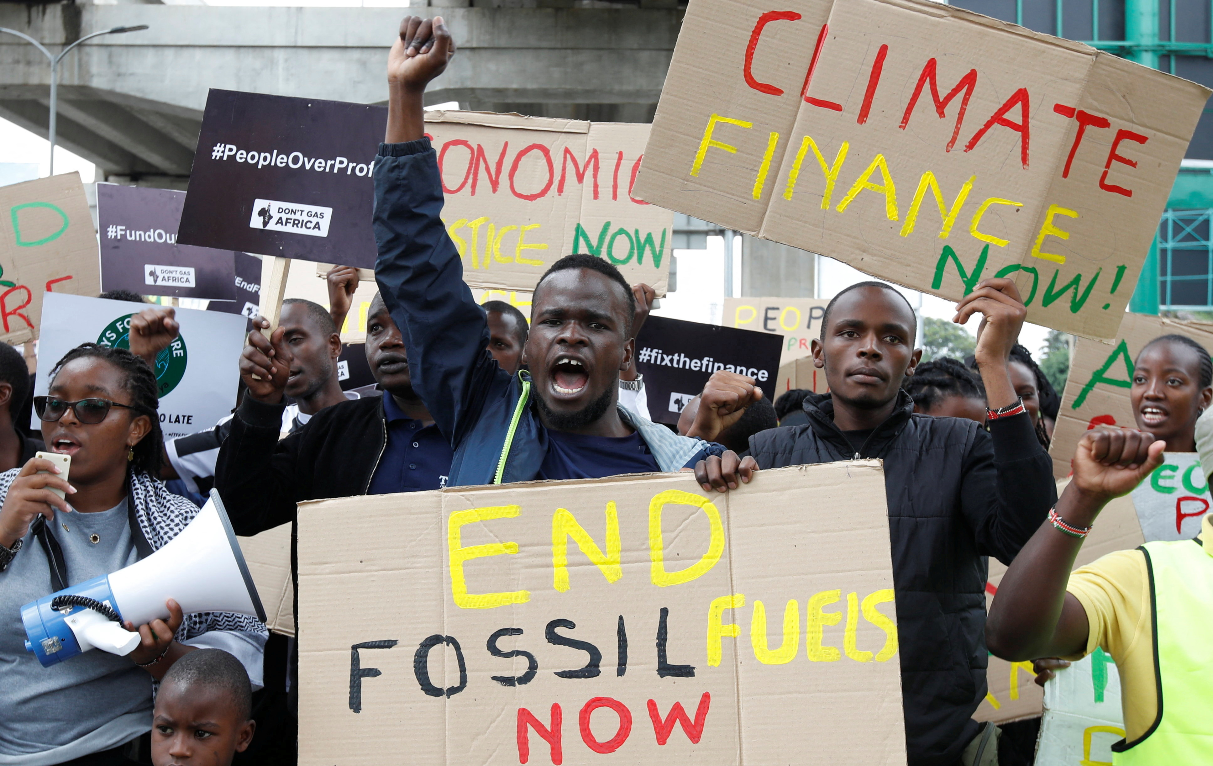 Climate activists participate in a protest demanding economic and climate liberation in Nairobi