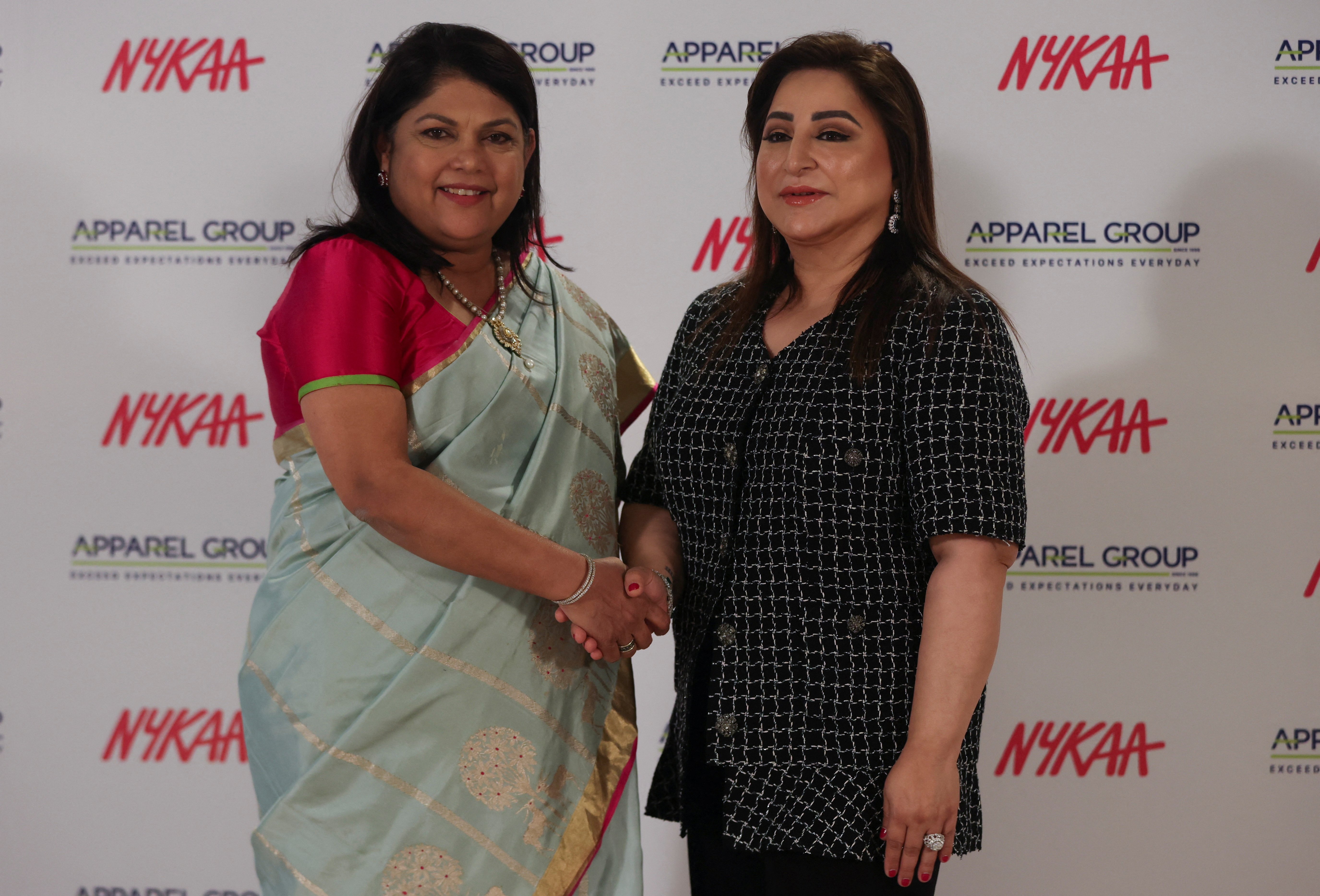 Falguni Nayar, founder and CEO of the beauty and lifestyle retail company Nykaa and Sima Ganwani Ved, Founder and Chairwoman of fashion and lifestyle retail conglomerate, Apparel Group pose for a picture during a strategic alliance announcement in Mumbai