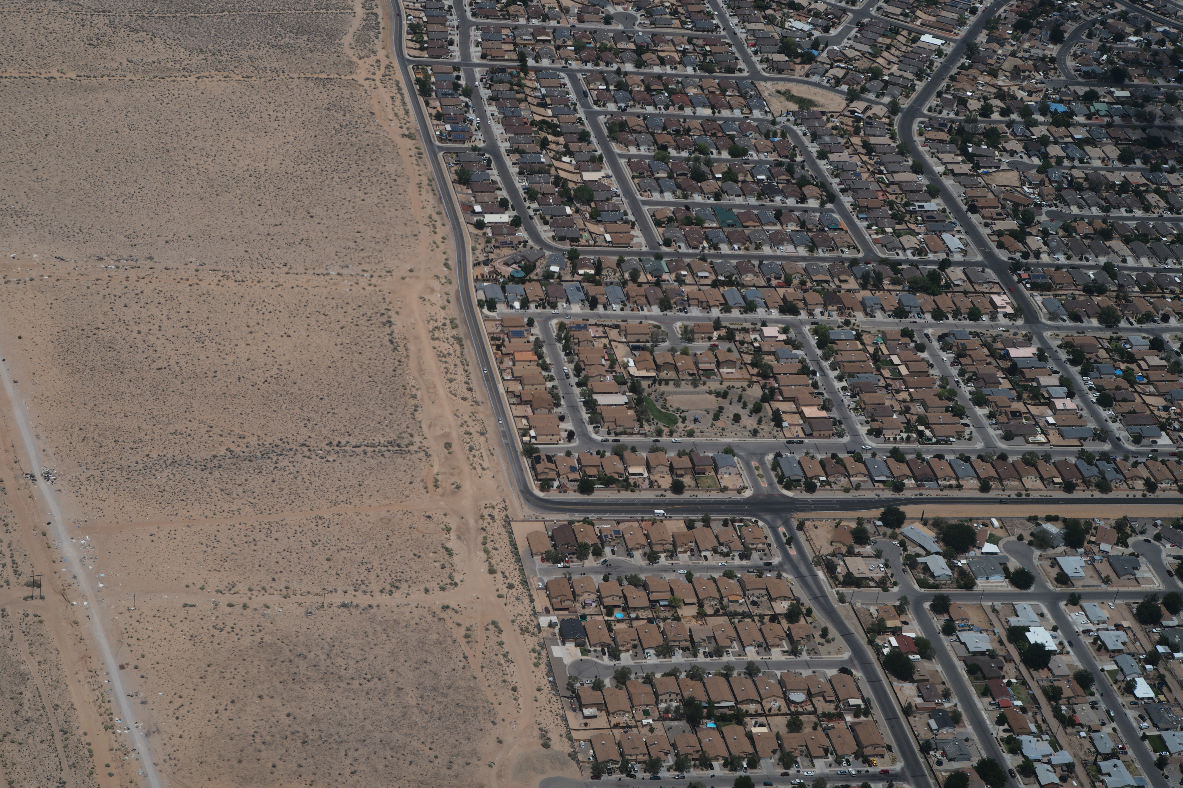Houses reach the edge of the desert on the outskirts of Albuquerque