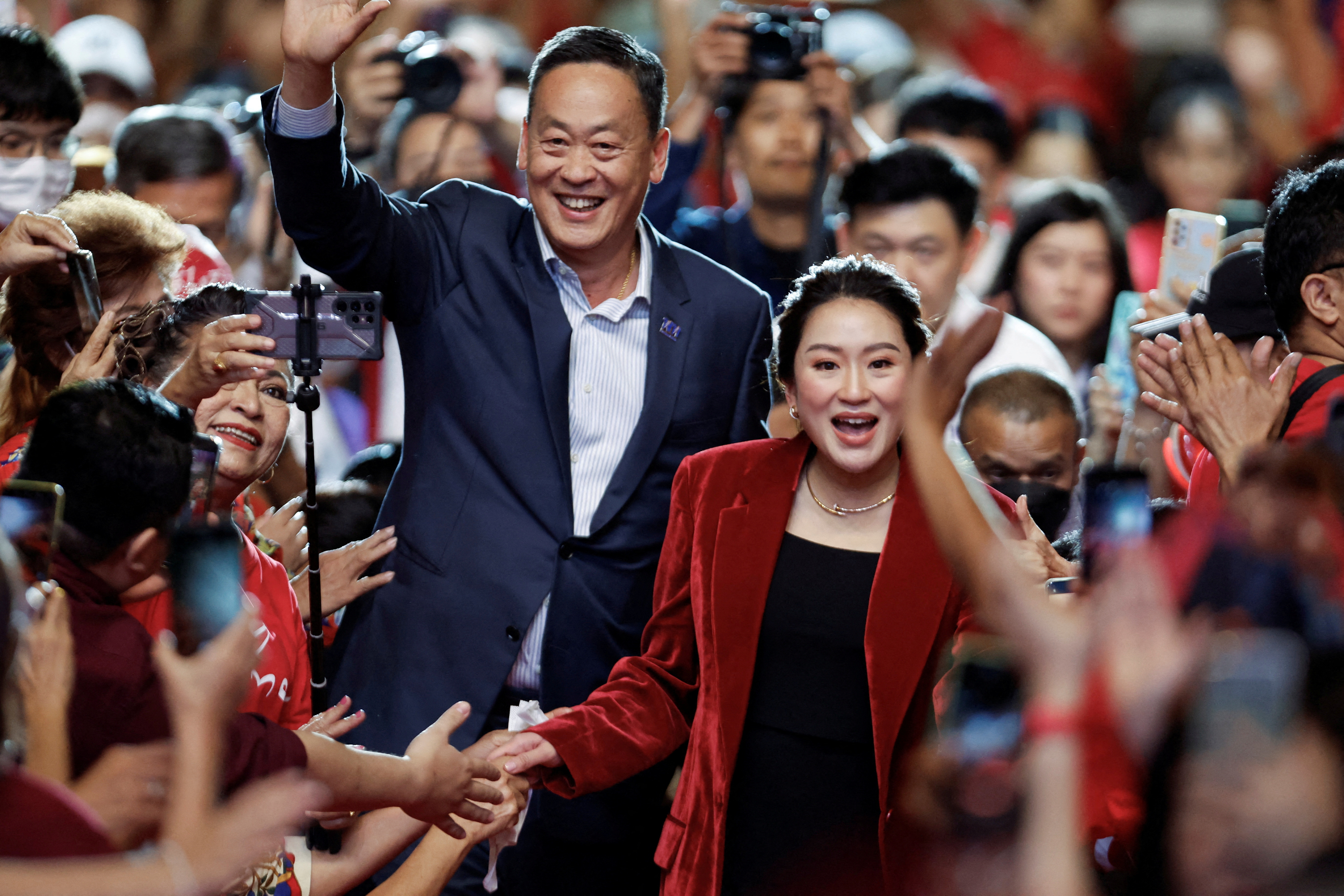 Thai prime minister candidate Paetongtarn Shinawatra and Srettha Thavisin at a rally two days before election, in Bangkok