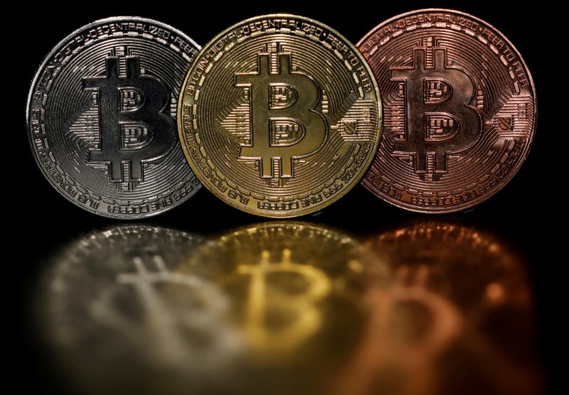 Representations of cryptocurrency Bitcoin are seen in this picture illustration taken June 7, 2021.   REUTERS/Edgar Su/Illustration