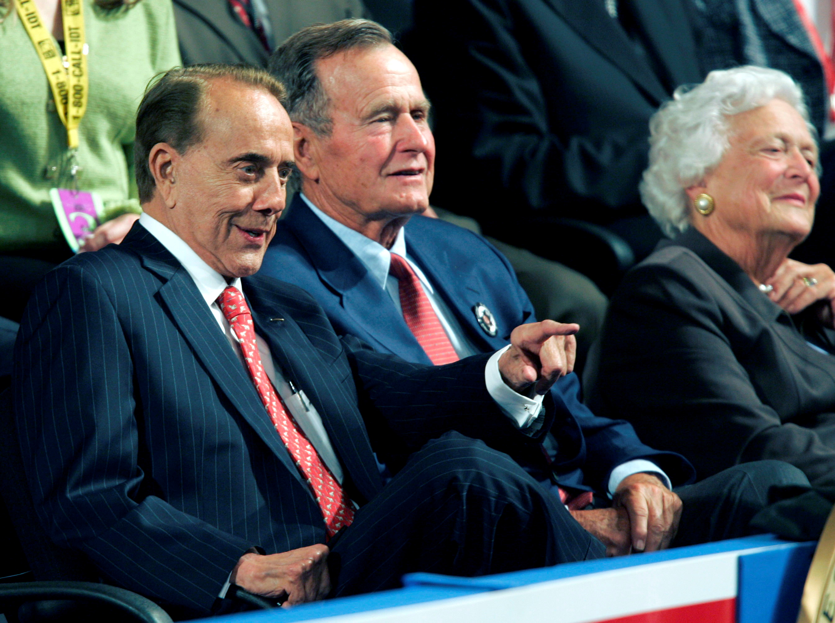 Bob Dole sits with former President Bush and his wife Barbara.