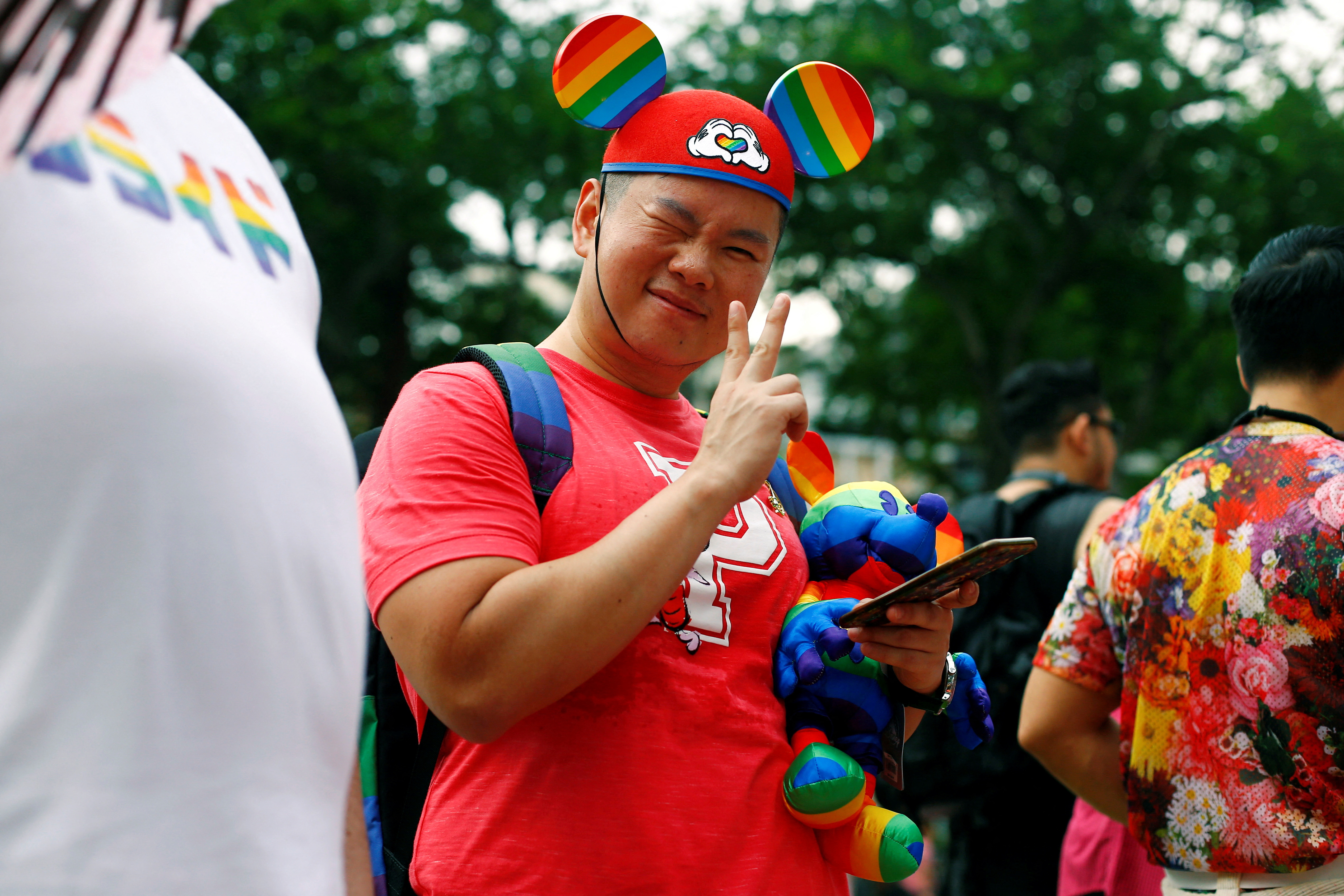 A participant of Pink Dot, an annual event organised in support of the LGBT community, poses for a photo at the Speakers' Corner in Hong Lim Park in Singapore