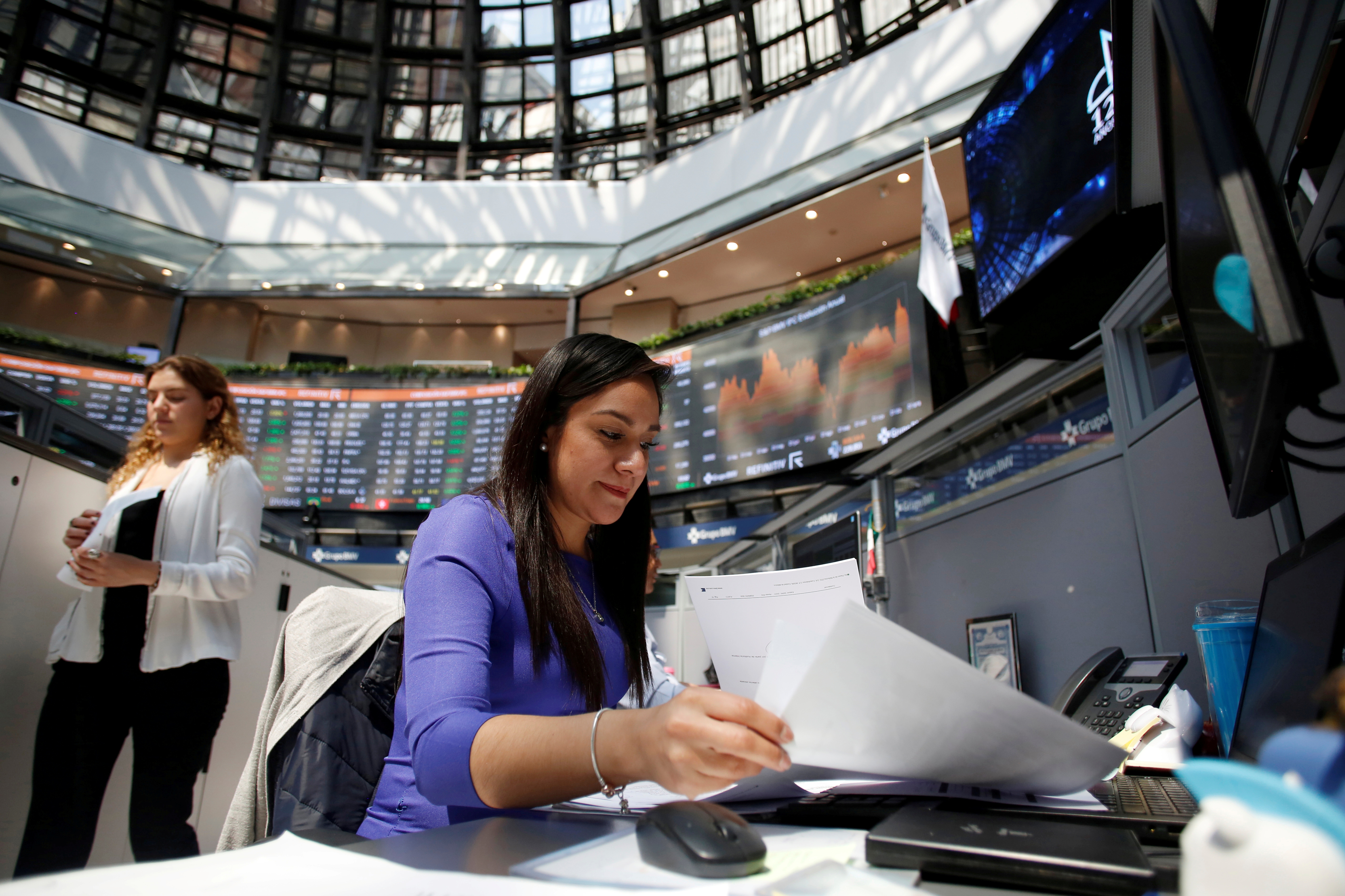 Employees work in Mexico's stock exchange in Mexico City