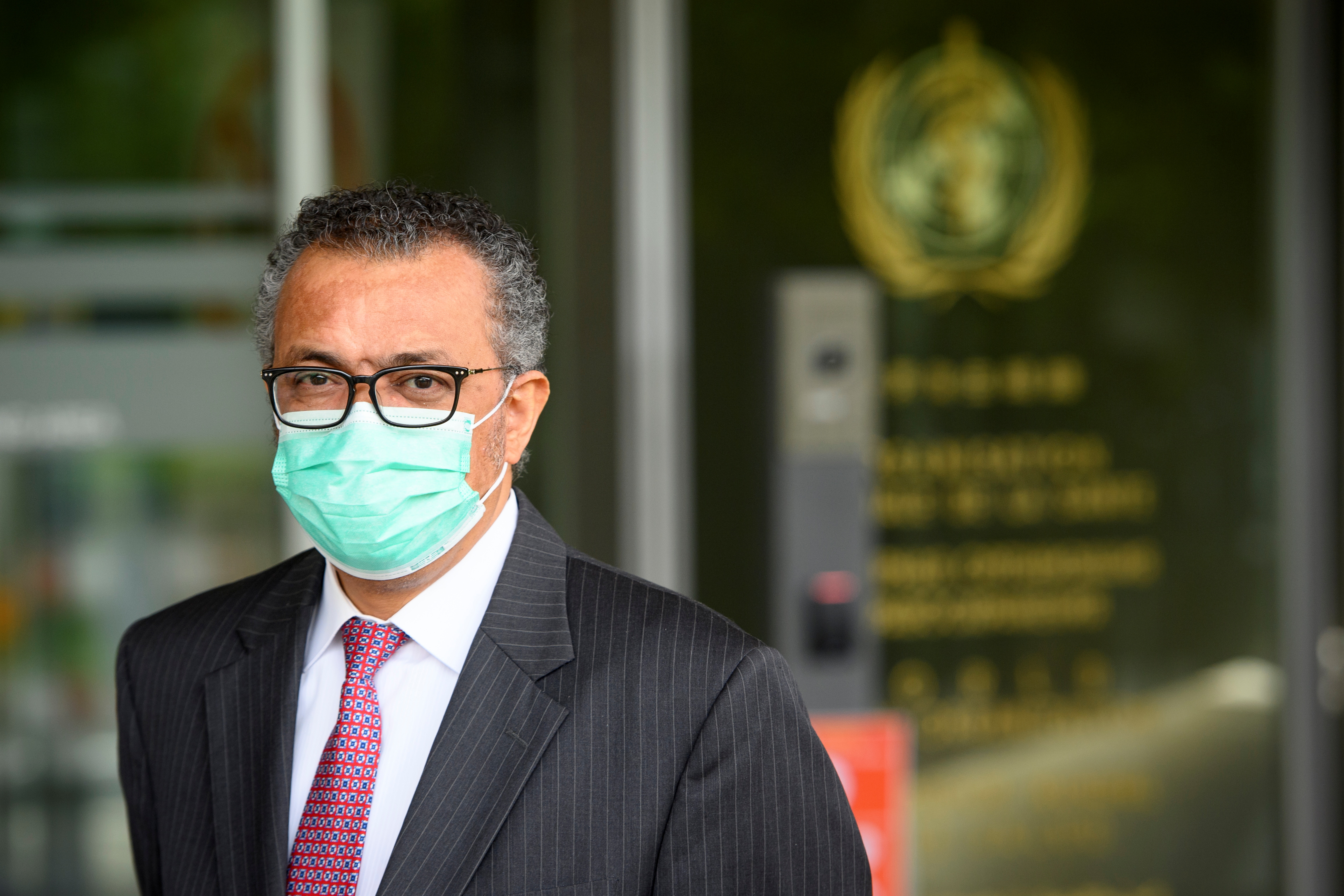 World Health Organization (WHO) Director General Tedros Adhanom Ghebreyesus waits for the arrival of Swiss Interior and Health Minister Alain Berset before a bilateral meeting on the sidelines of the opening of the 74th World Health Assembly at the WHO headquarters, in Geneva, Switzerland May 24, 2021. Laurent Gillieron/Pool via REUTERS