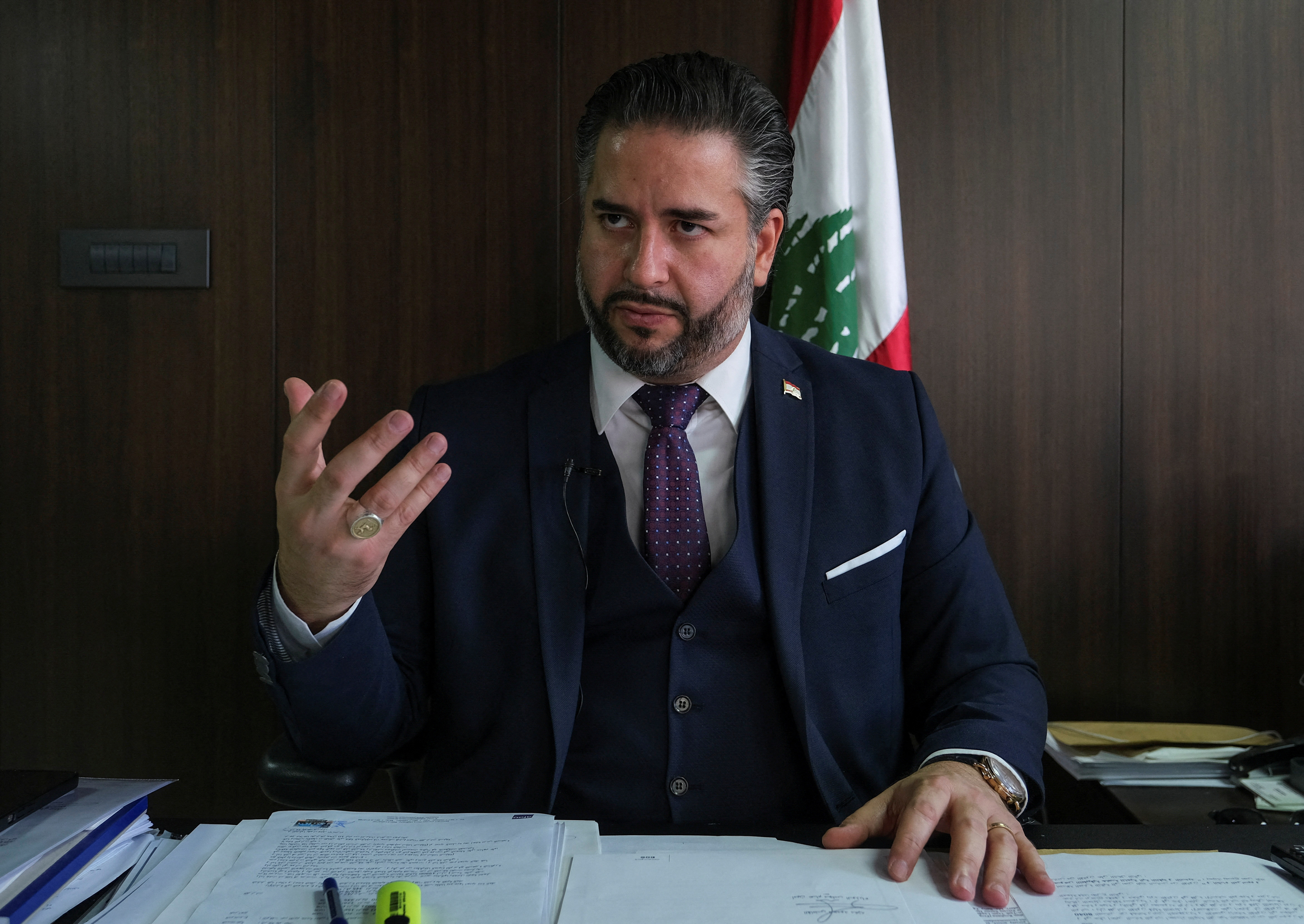 Caretaker Economy Minister Amin Salam gestures during an interview with Reuters in Beirut