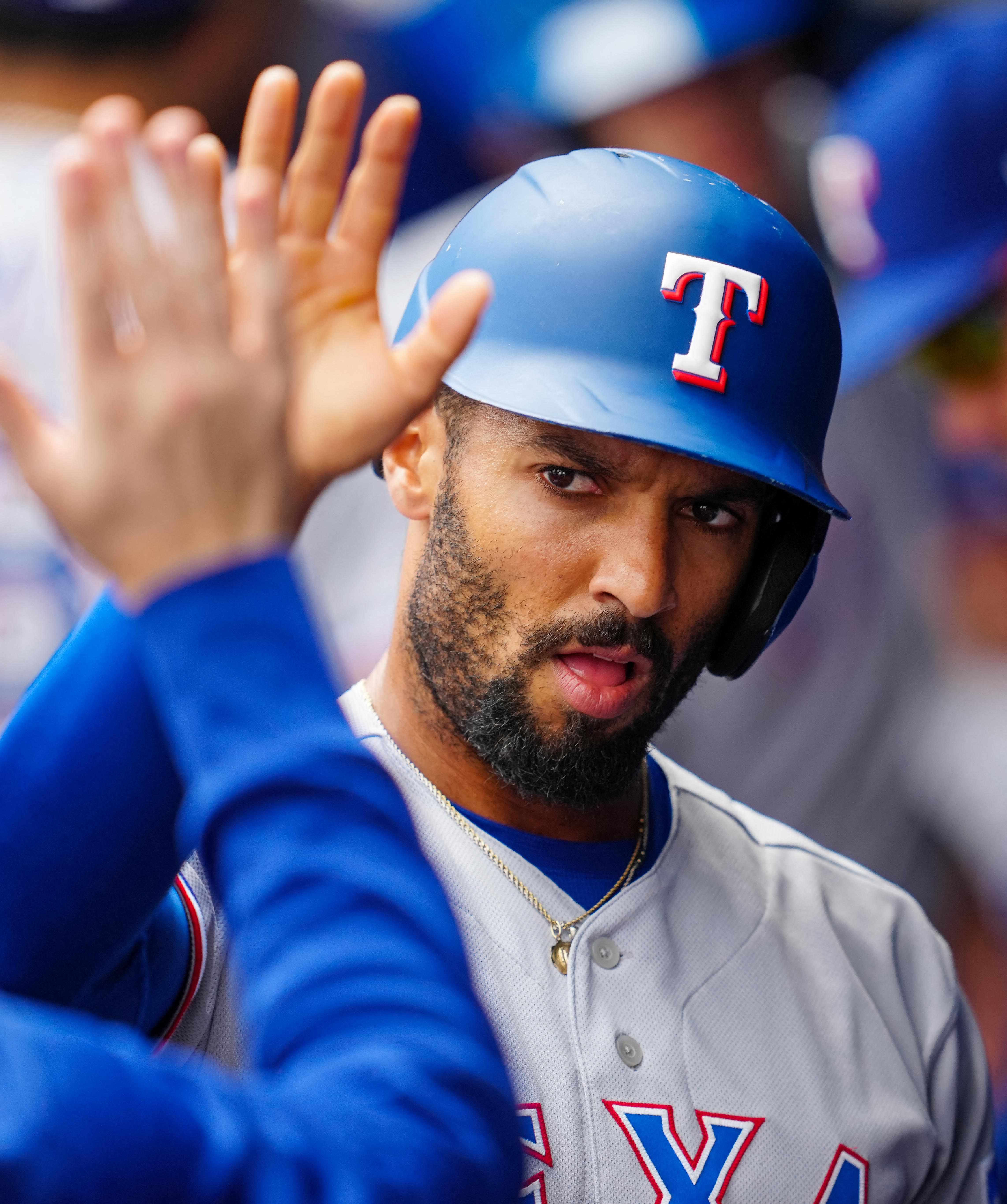 Heim, Semien lead Rangers to 12-3 win over KC, series sweep