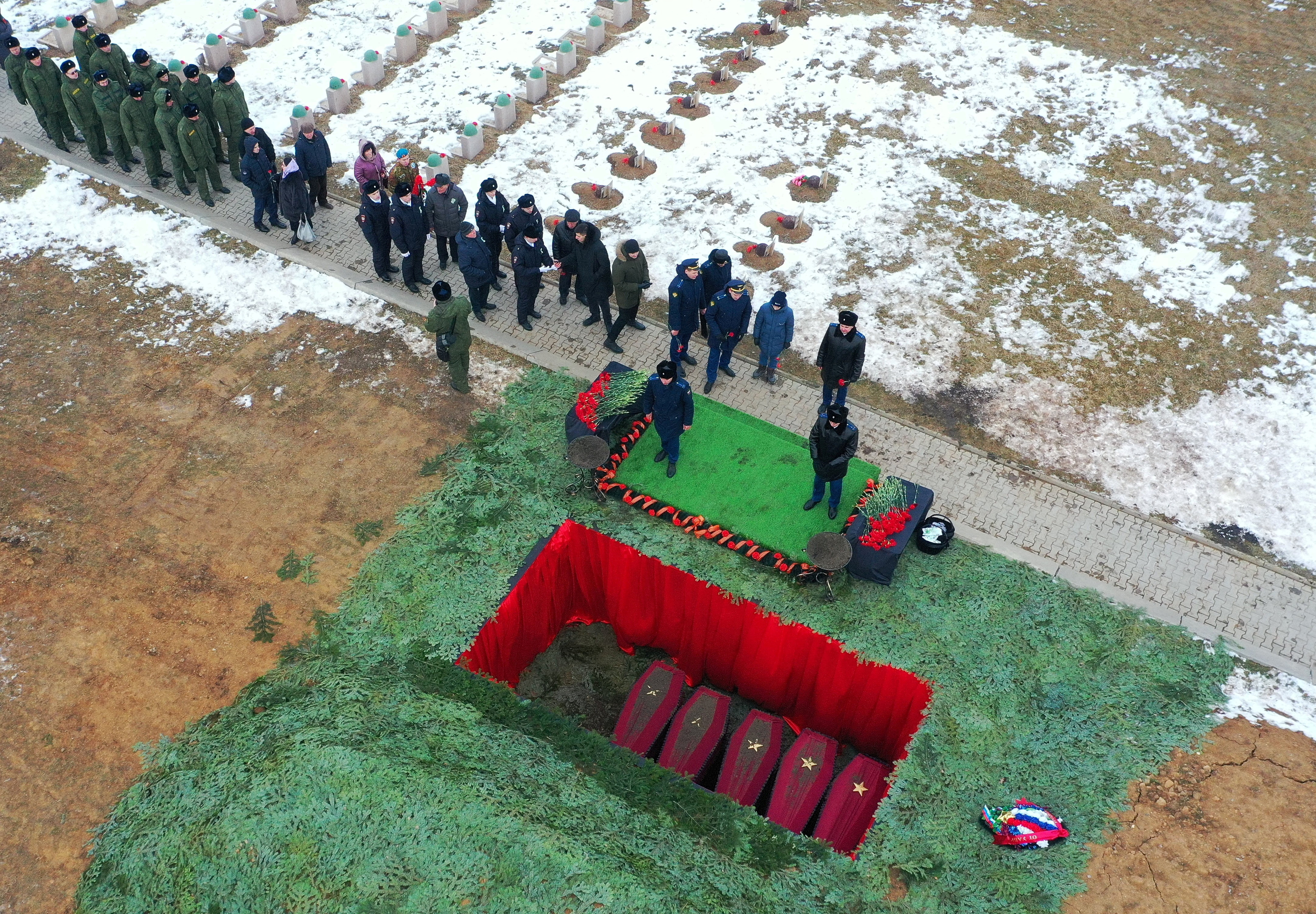 Participants attend a ceremony to rebury the remains of Red Army soldiers killed during World War Two in Volgograd region