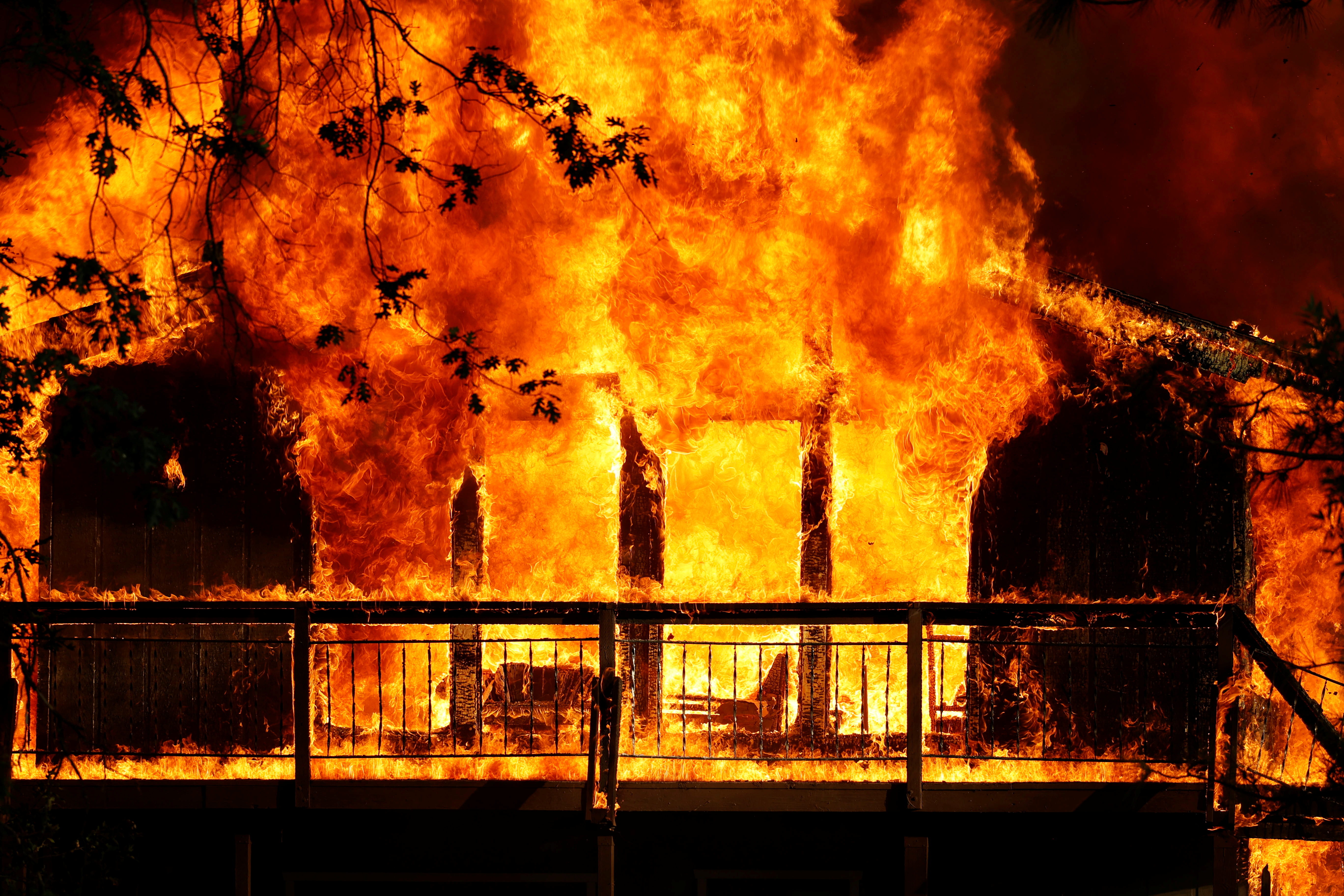A home is consumed by flames in the River Fire, a wildfire burning in Grass Valley, California, U.S., August 4, 2021. REUTERS/Fred Greaves