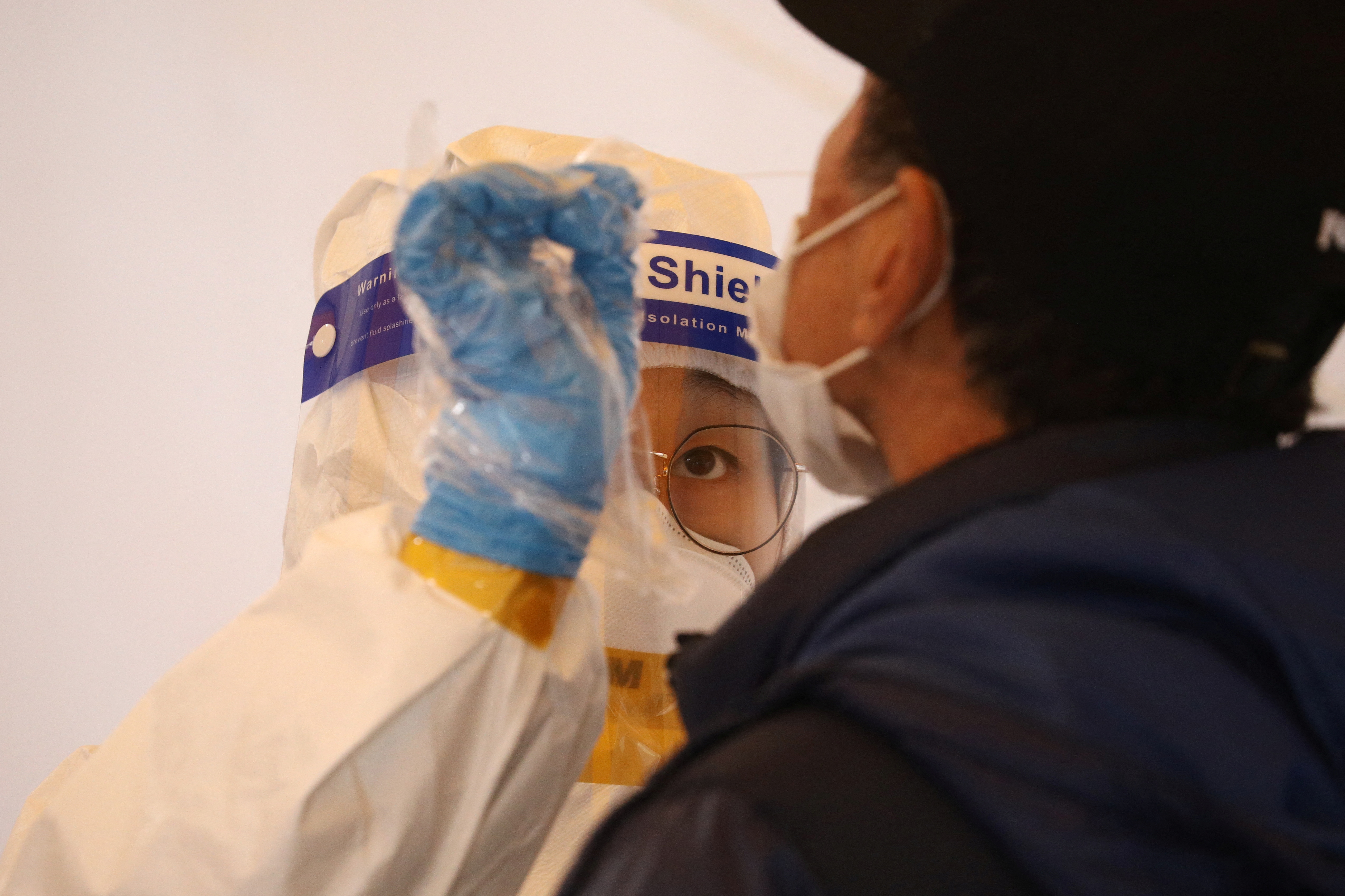 A man undergoes coronavirus disease (COVID-19) test at a testing site in Seoul