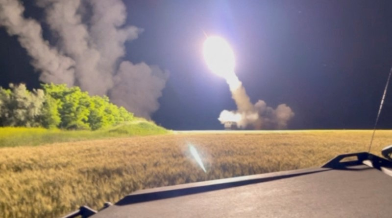 A view shows a M142 High Mobility Artillery Rocket System (HIMARS) is being fired in an undisclosed location