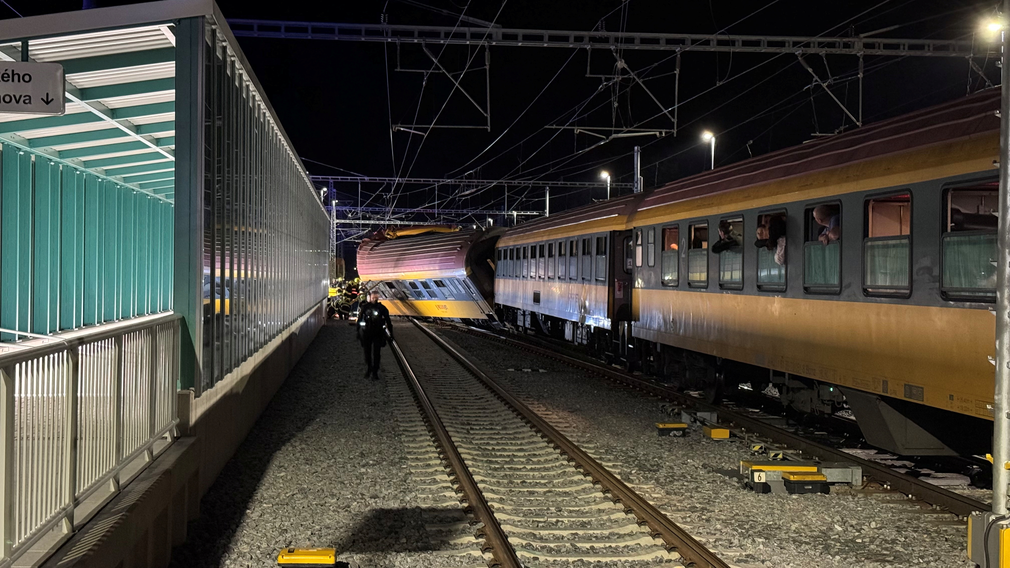 A view of a derailed train carriage following a collision between a passenger train and a freight train in Pardubice