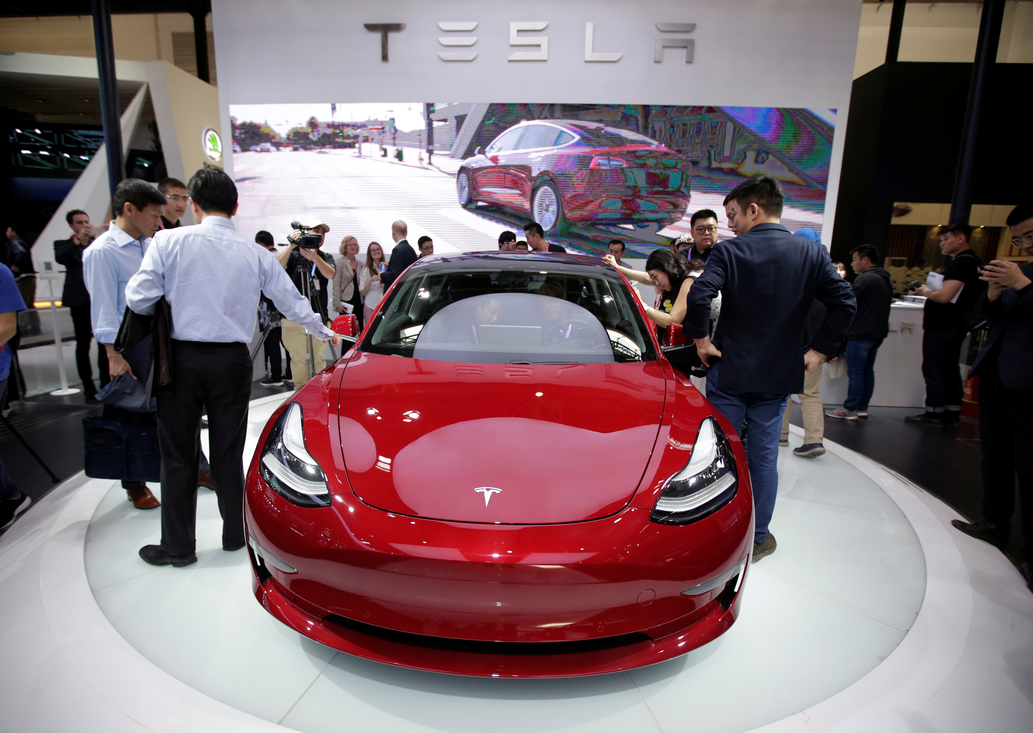 A Tesla Model 3 car is displayed during a media preview at the Auto China 2018 motor show in Beijing