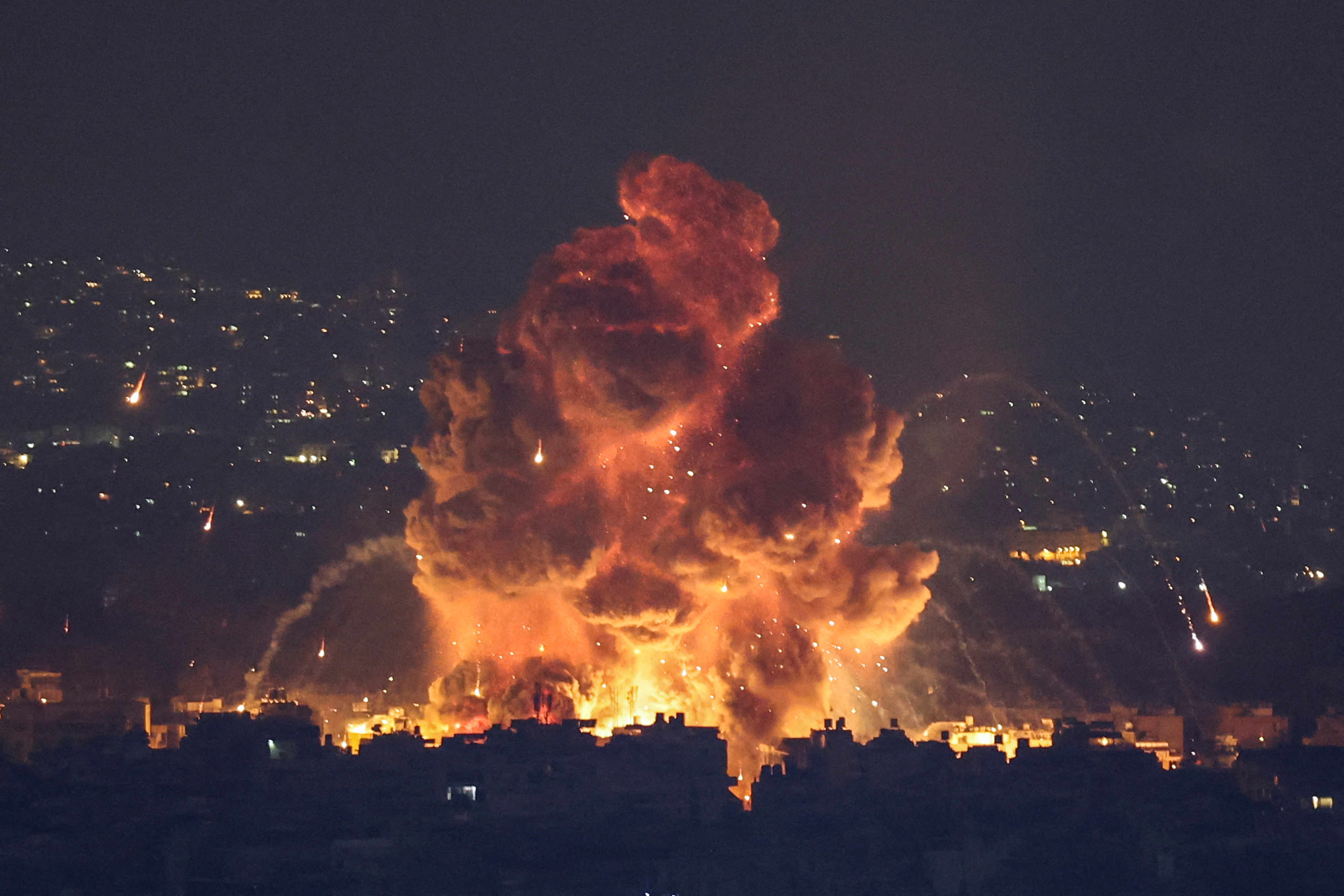 Smoke and flames rise in Beirut's southern suburbs, after Israeli air strikes, amid ongoing hostilities between Hezbollah and Israeli forces, as seen from Sin El Fil