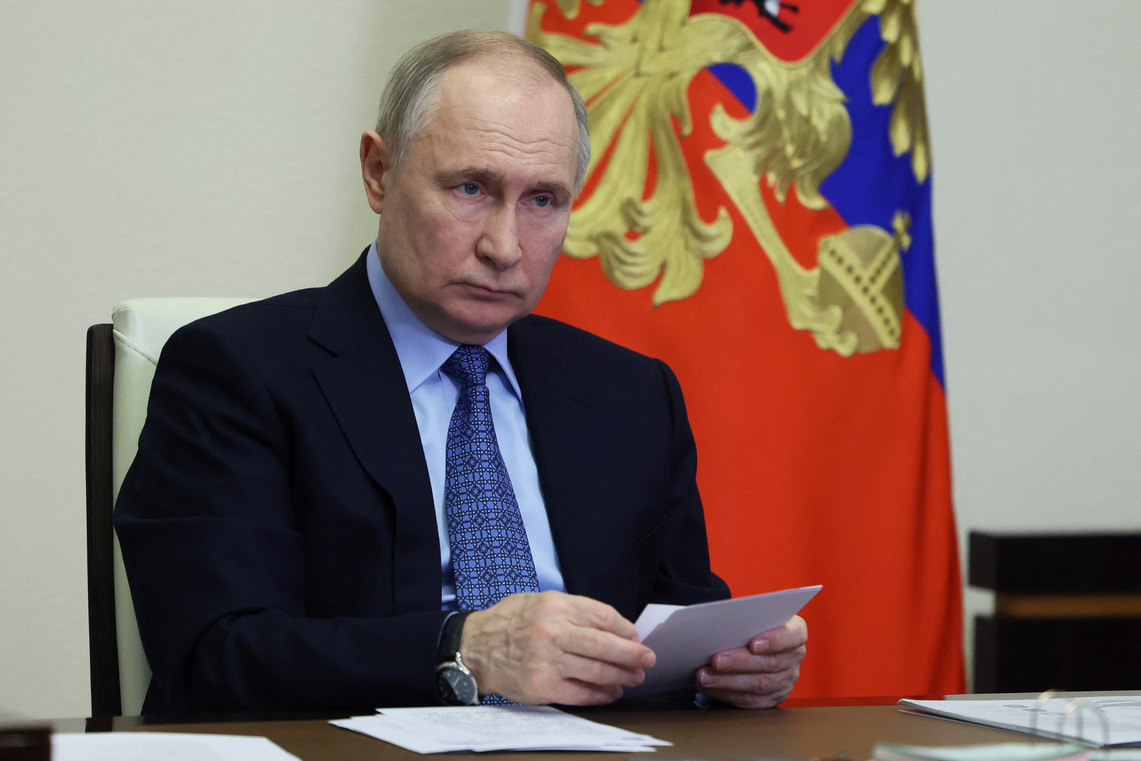 Russian President Putin chairs a meeting via video link at a residence outside Moscow