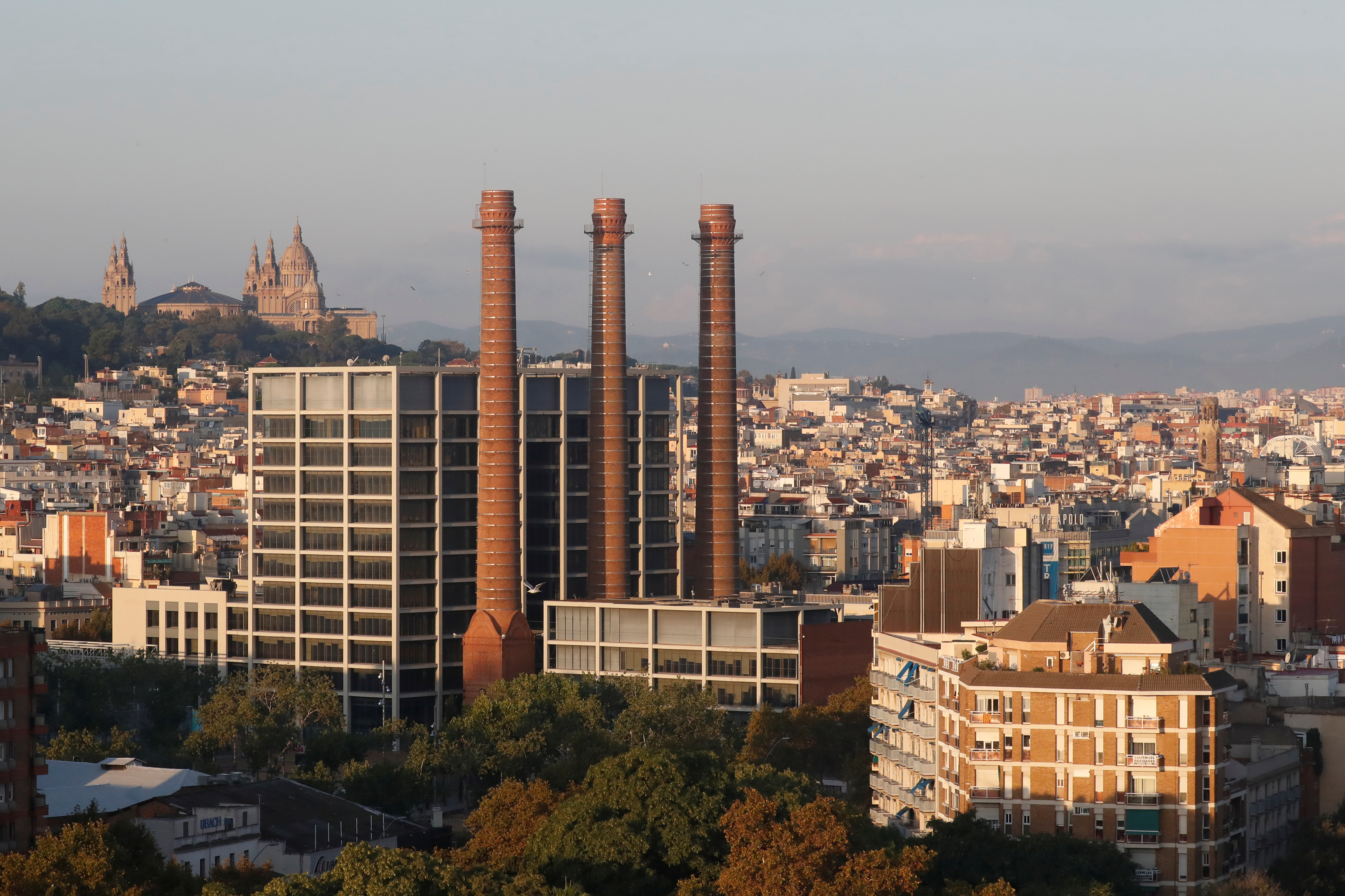 A general view shows Barcelona with Montjuic Castle in the background