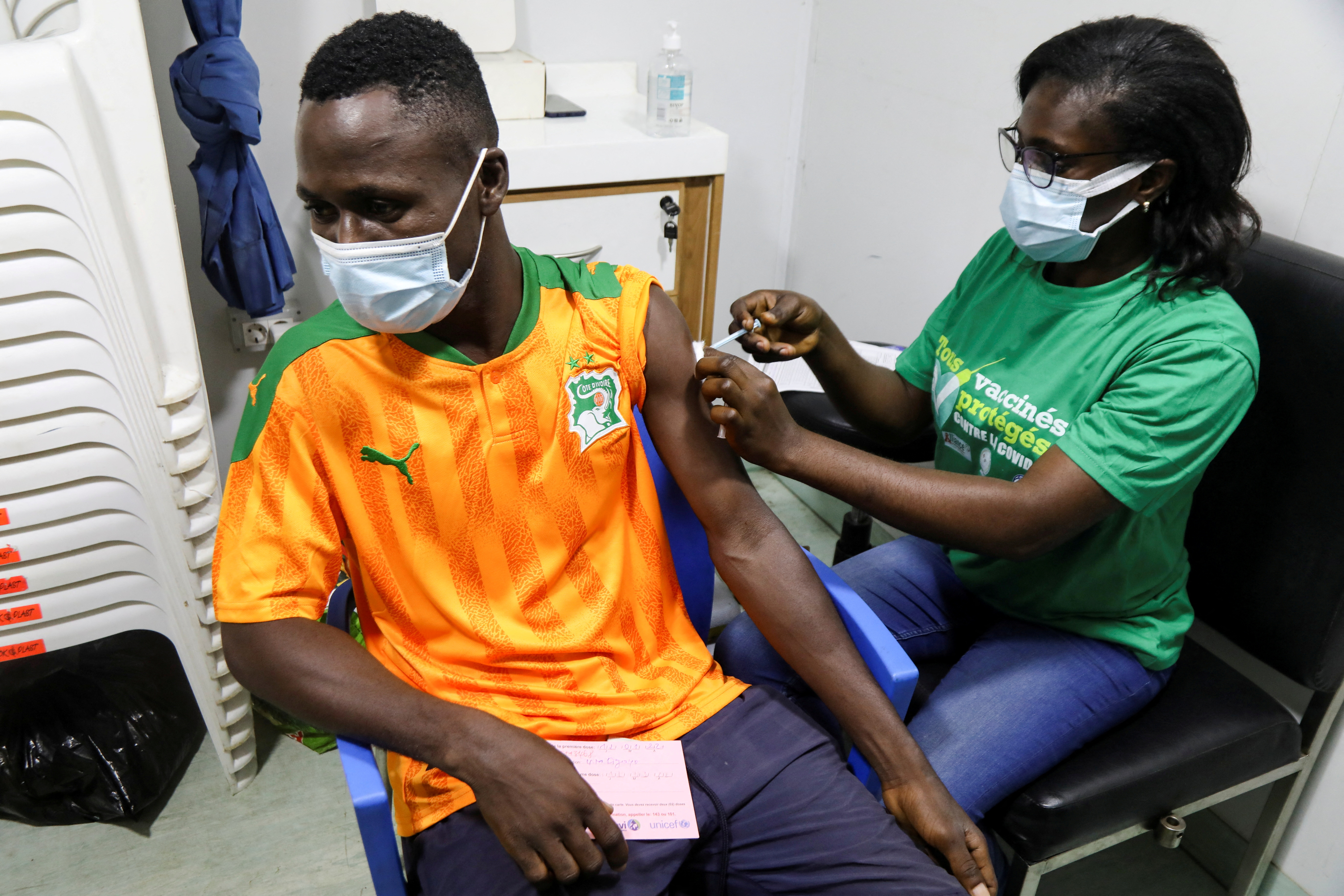 Soccer fans in Ivory Coast get the vaccinated against the coronavirus disease (COVID-19) to watch their team play