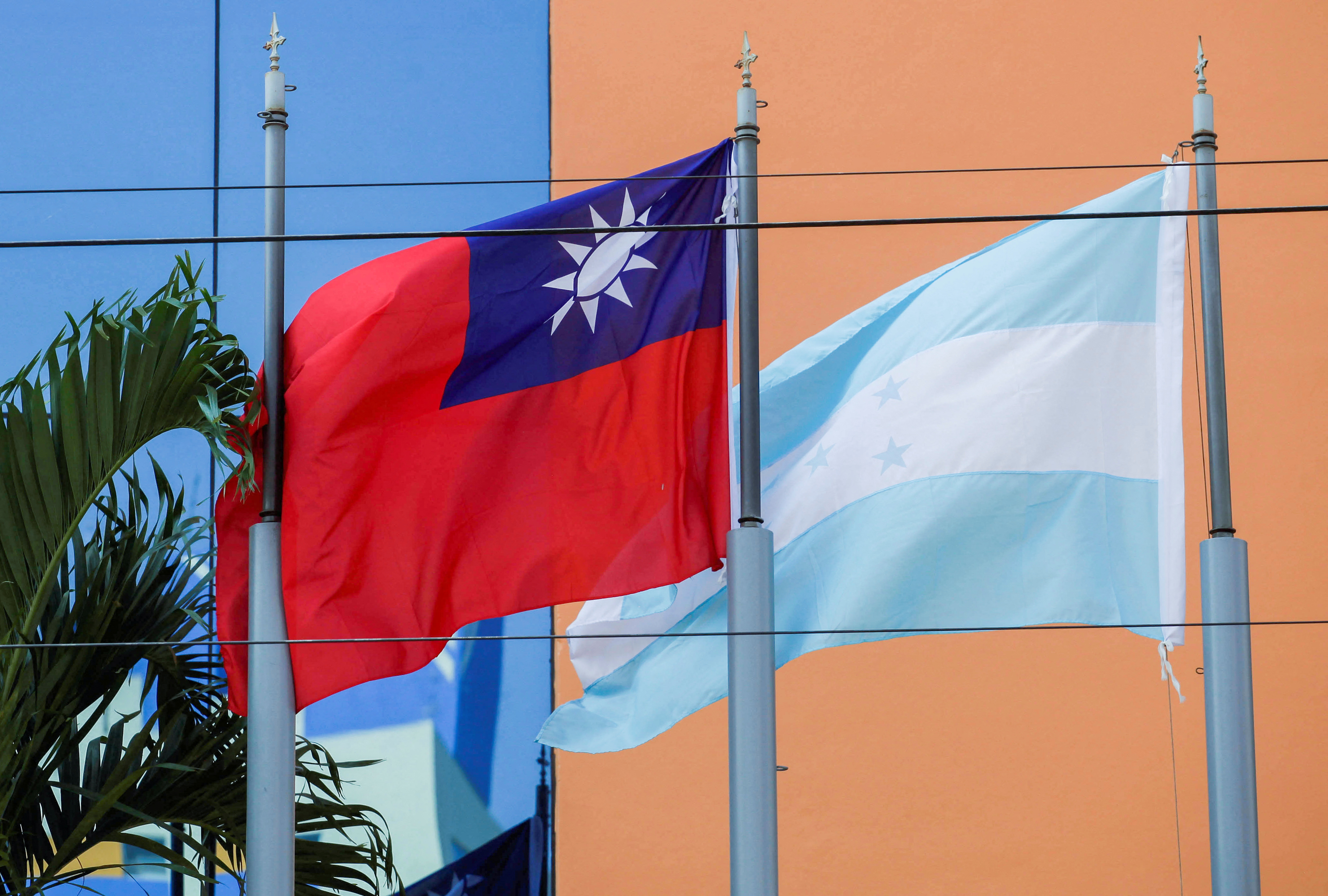 The flags of Taiwan and Honduras flutter in the wind outside the Taiwan Embassy in Tegucigalpa