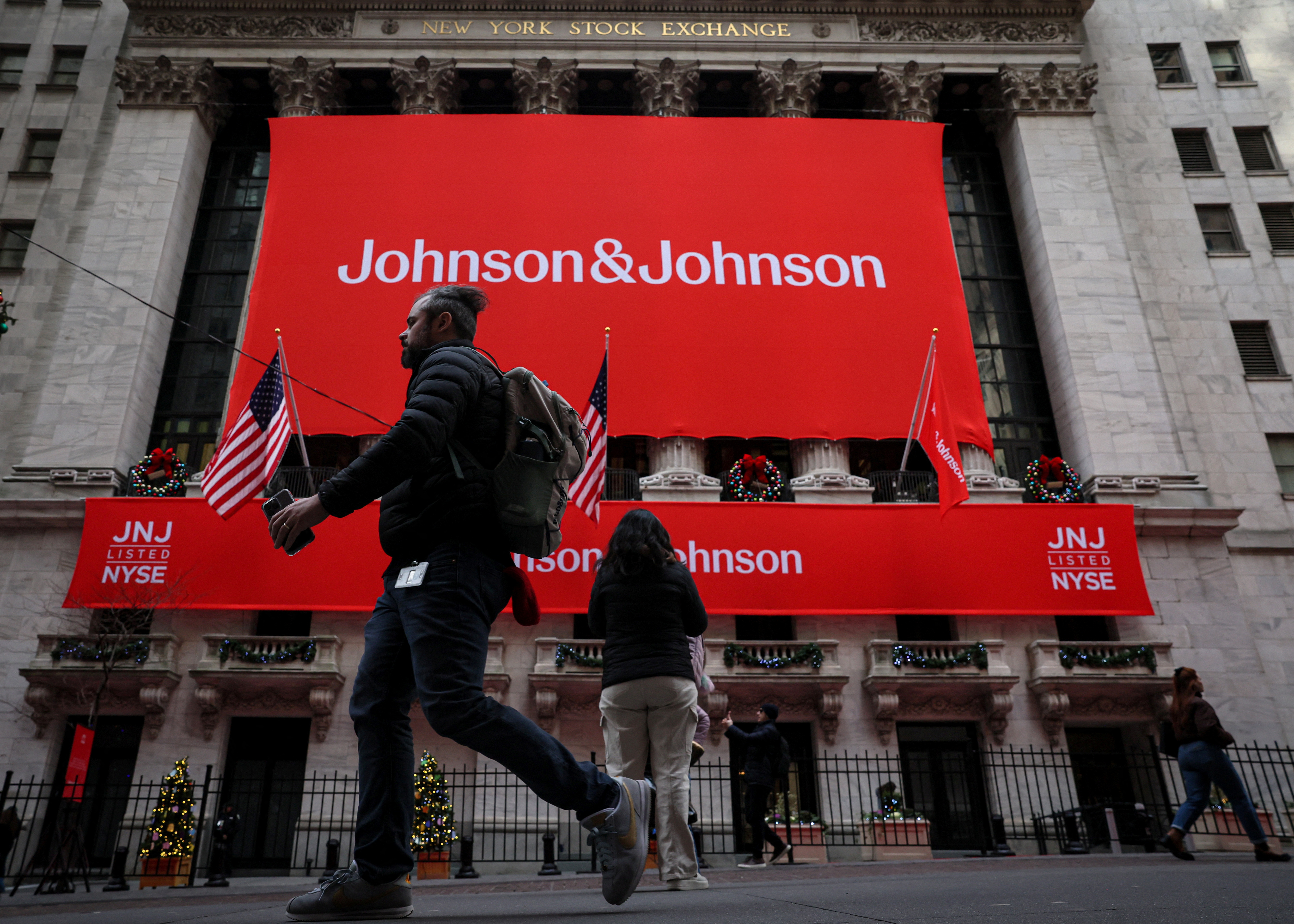 A Johnson & Johnson banner is displayed on the front of the NYSE in New York