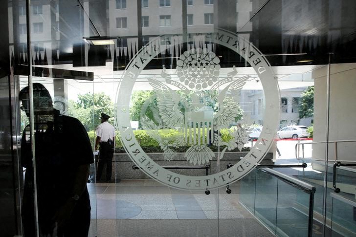 An employee enters the State Department