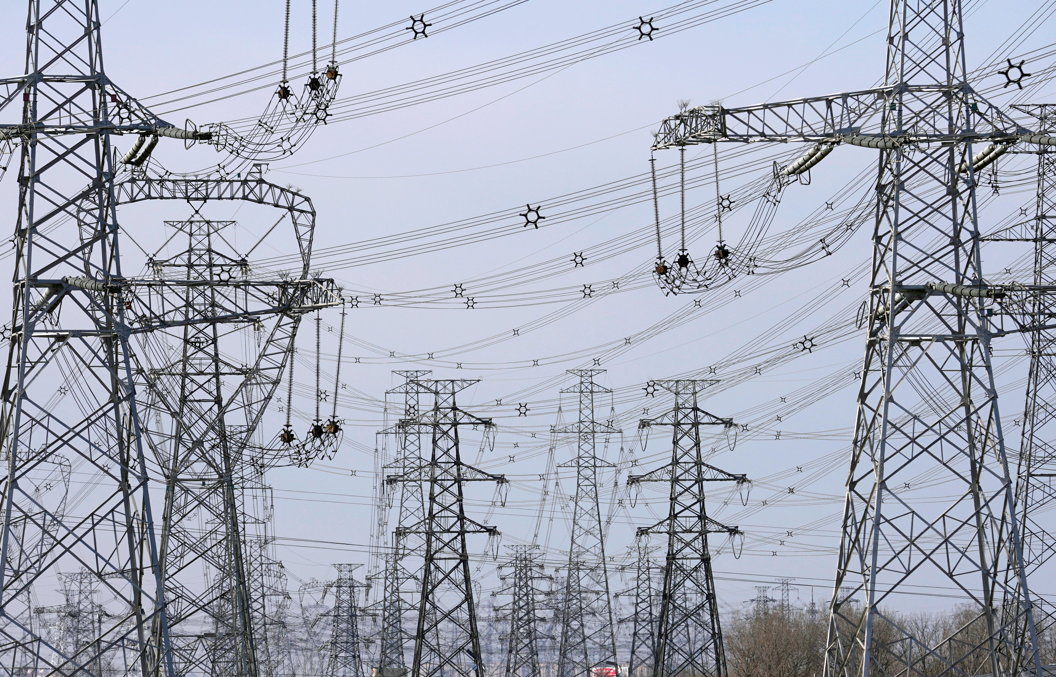 Power lines are seen along a highway on the outskirts of Beijing, China February 3, 2018. Picture taken February 3, 2018. REUTERS/Jason Lee/Files