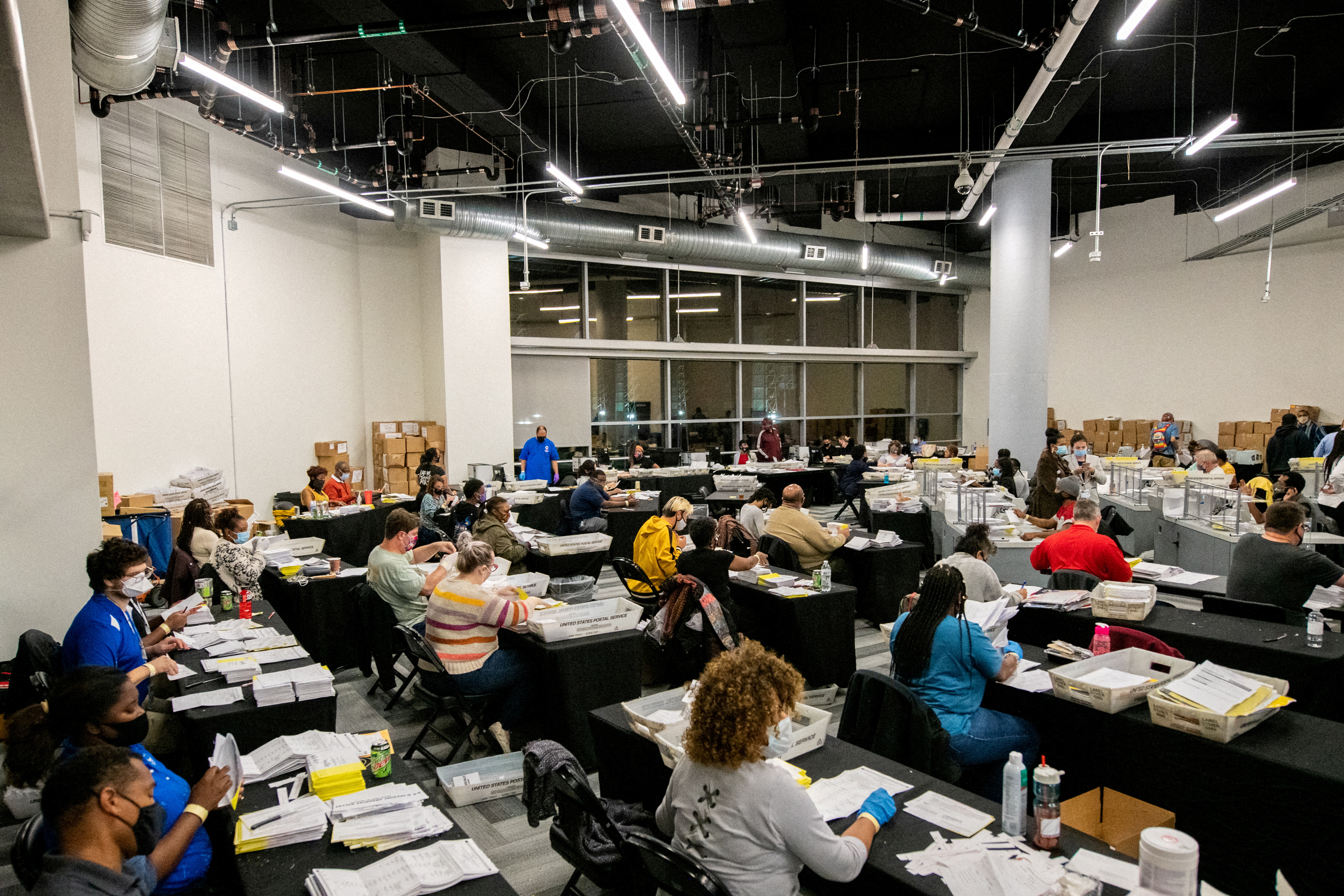 Employees of the Fulton County Board of Registration and Elections process ballots in Atlanta, Georgia, U.S., November 4, 2020. REUTERS/Brandon Bell/File Photo