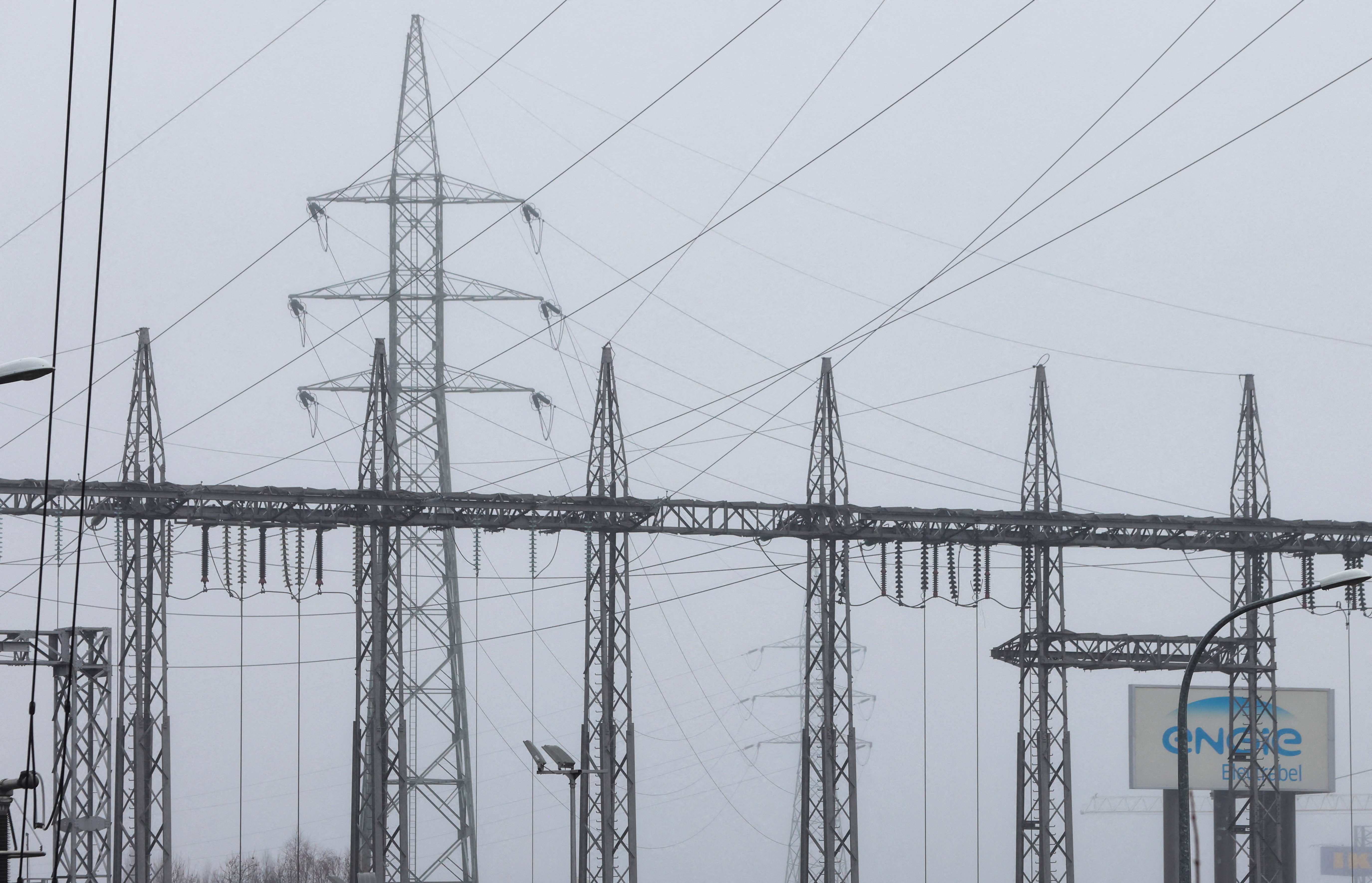 Electric pylons are seen at a combined-cycle gas turbine power plant in Drogenbos