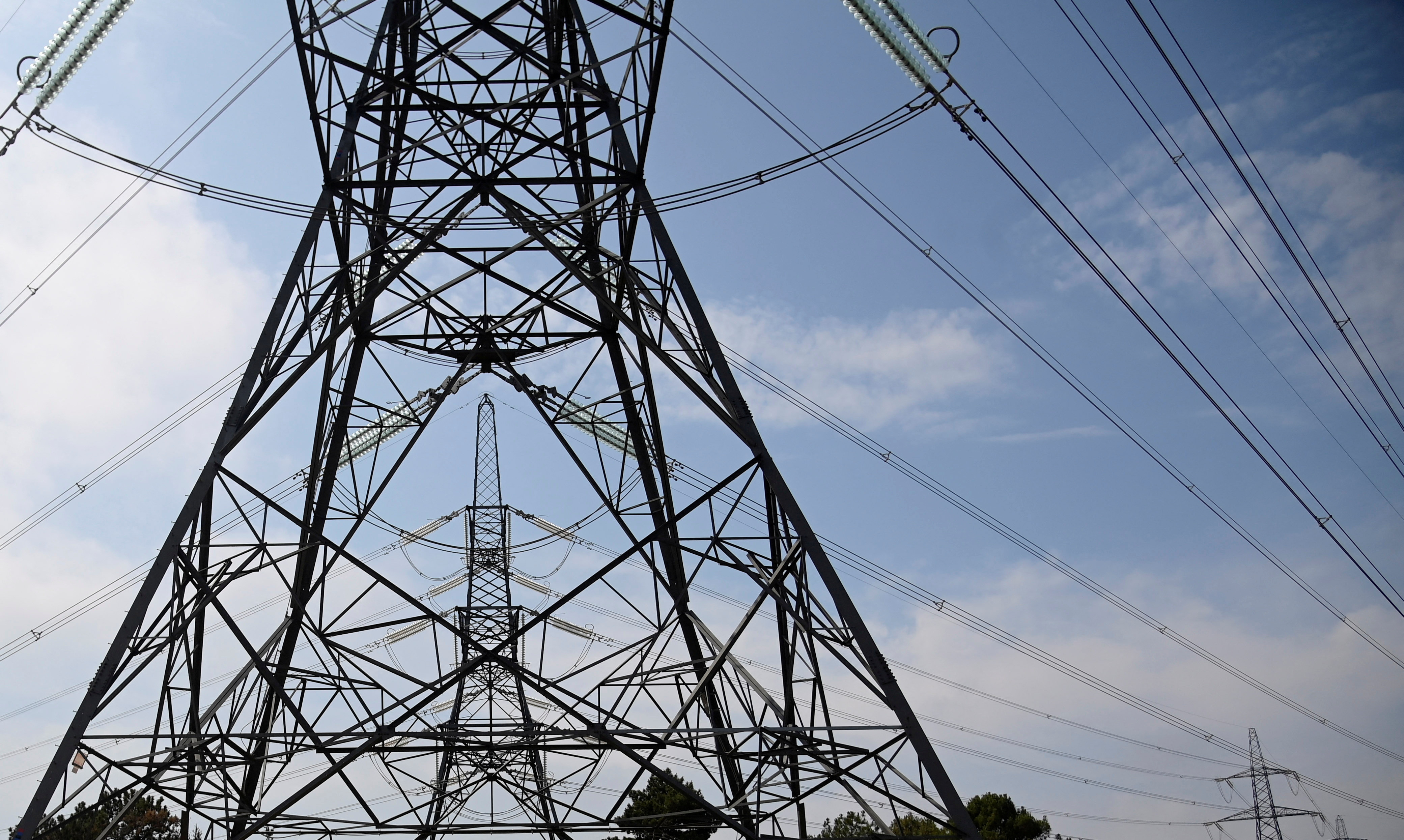 Electricity pylons are seen near Ashford