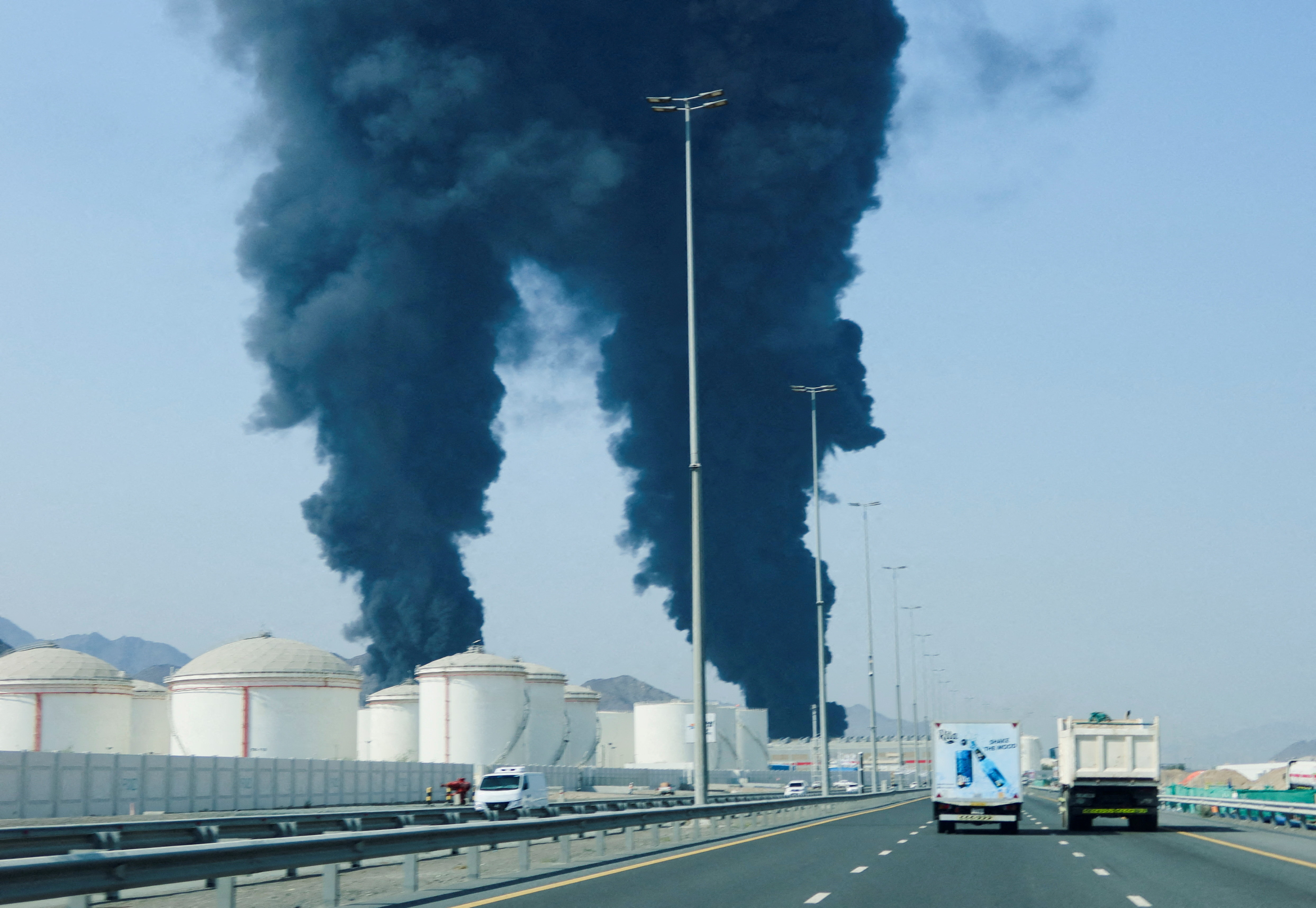 Fujairah oil zone hit by fire after drone attack as UAE says it intercepted Iran missiles