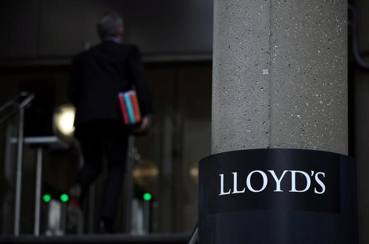Man enters the Lloyd's of London building in the City of London financial district