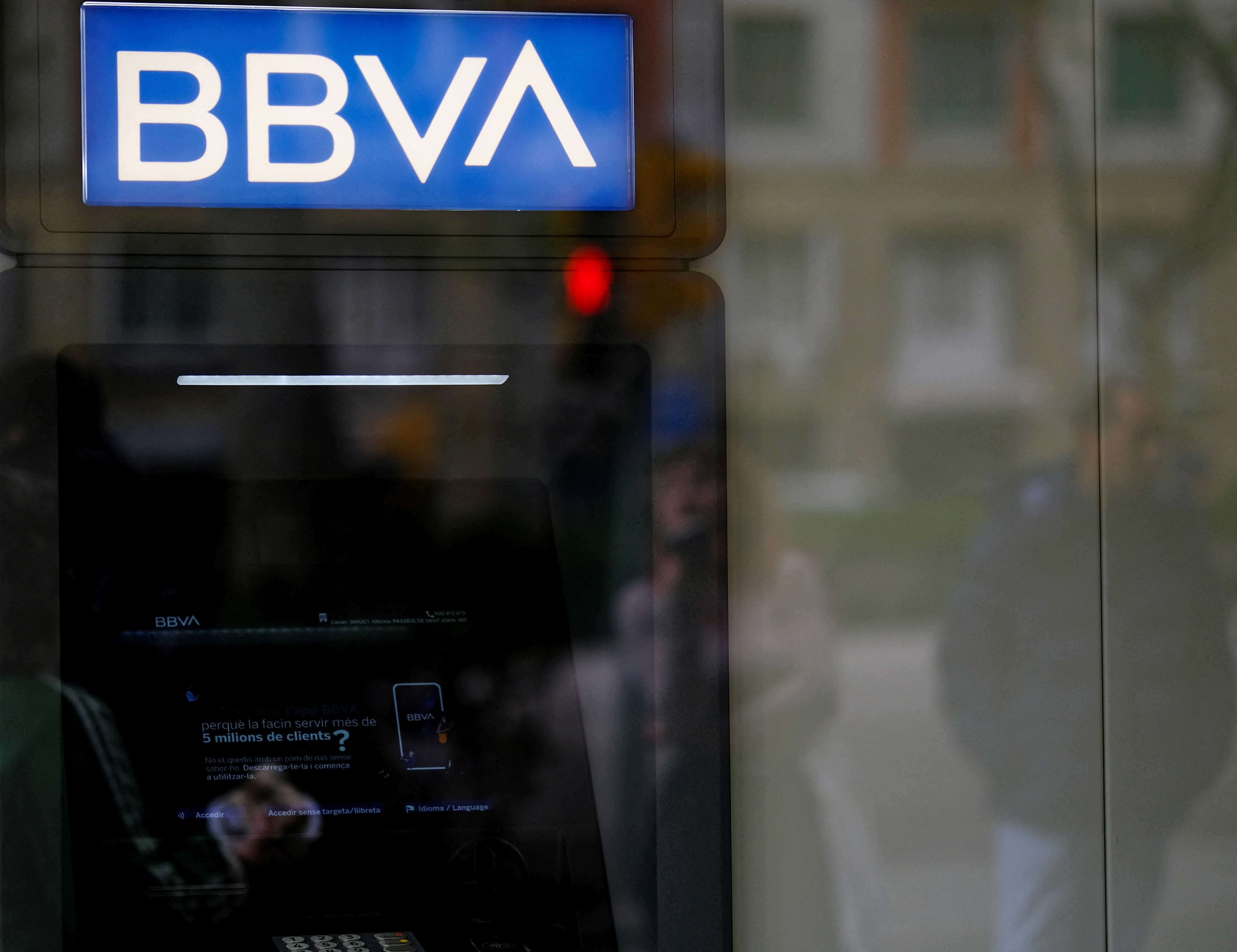 An ATM machine is seen at a BBVA bank branch office, in Barcelona