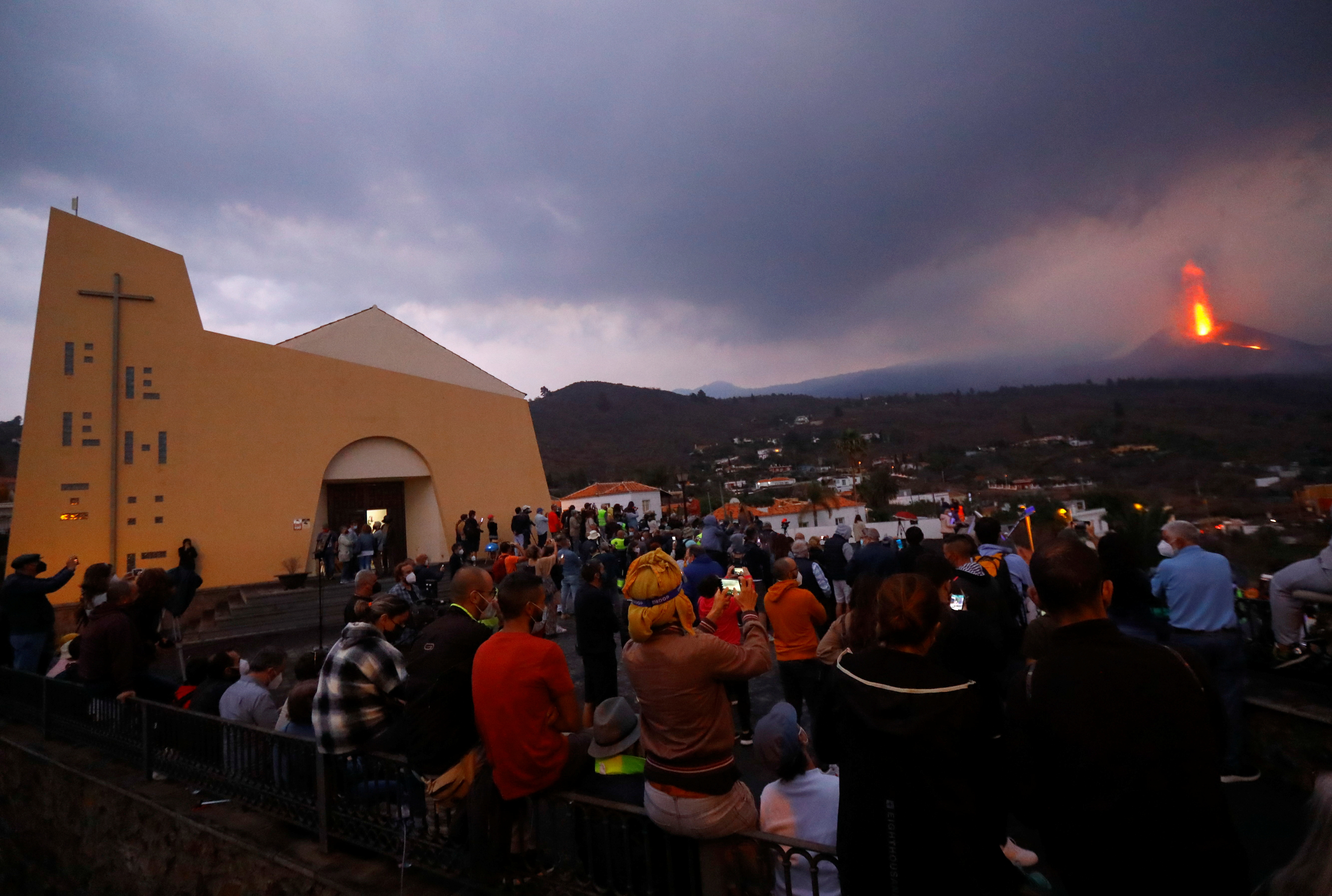 Tourists arrive at the Tajuya viewpoint to see the Cumbre Vieja volcano that continues to expel lava