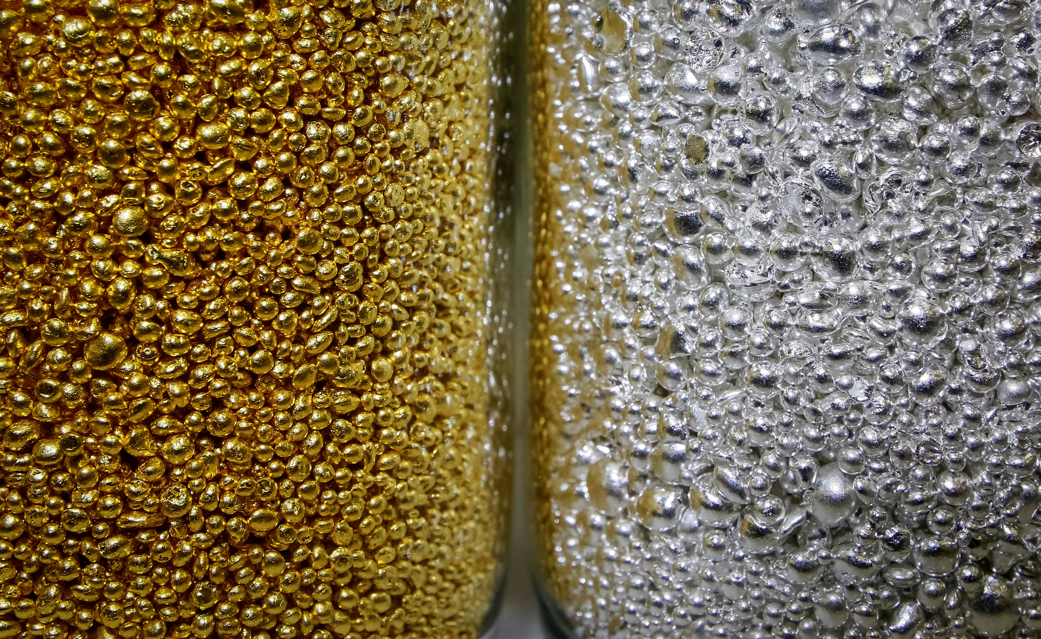 Granules of 99.99 percent pure gold and silver are seen in glass jars at the Krastsvetmet non-ferrous metals plant in the Siberian city of Krasnoyarsk