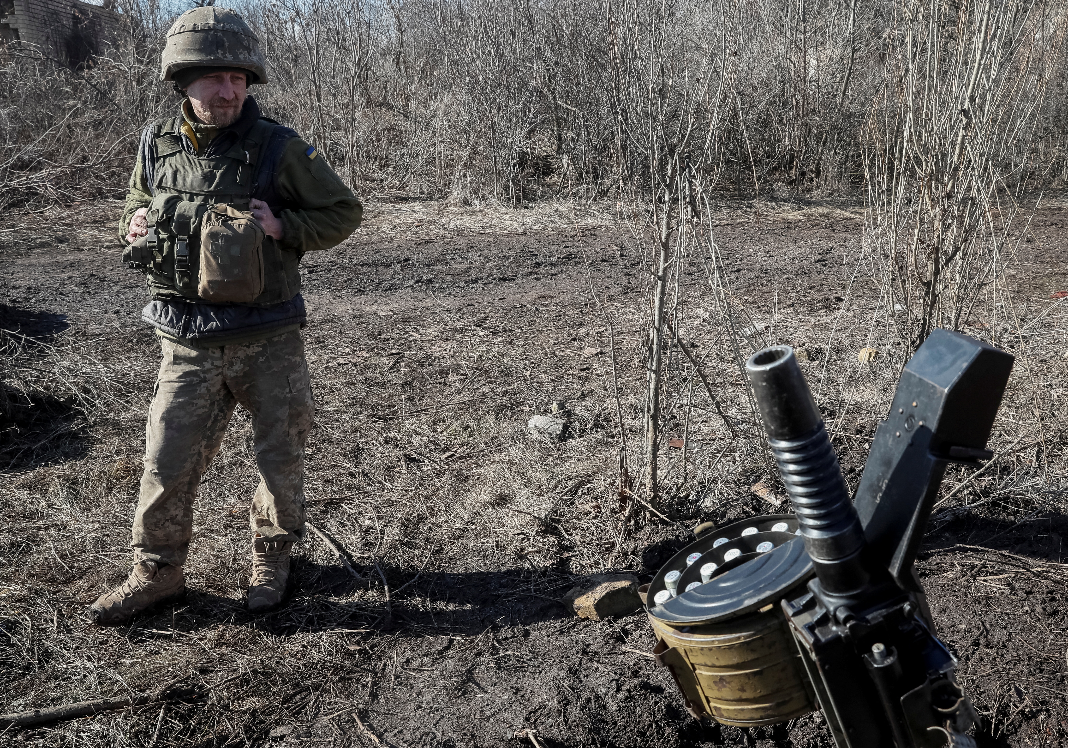 A Ukrainian service member is seen on the front line near the village of Zaitseve in the Donetsk region, Ukraine February 19, 2022. REUTERS/Gleb Garanich
