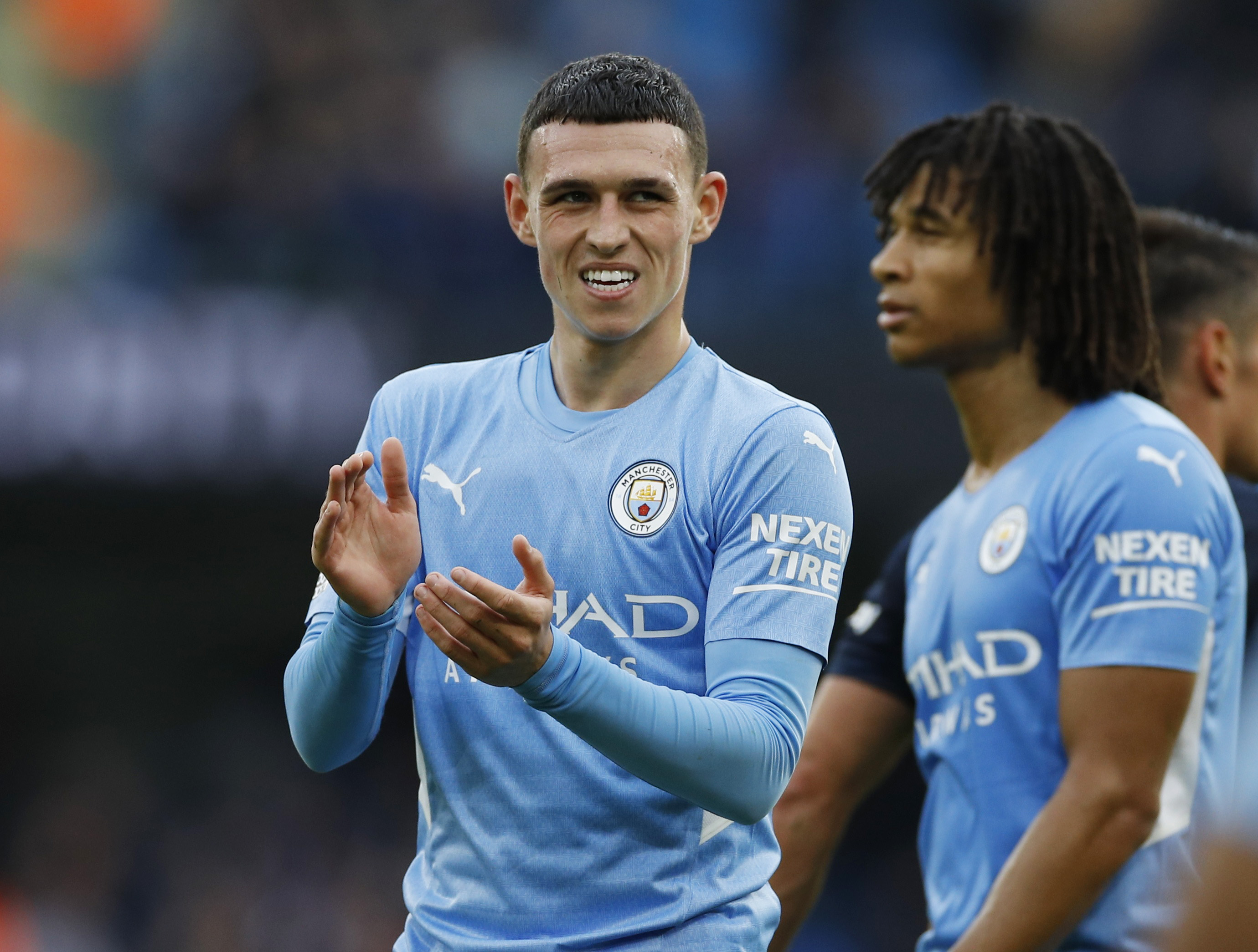 Soccer Football - Premier League - Manchester City v Burnley - Etihad Stadium, Manchester, Britain - October 16, 2021  Manchester City's Phil Foden celebrates with Nathan Ake after the match REUTERS/Phil Noble 