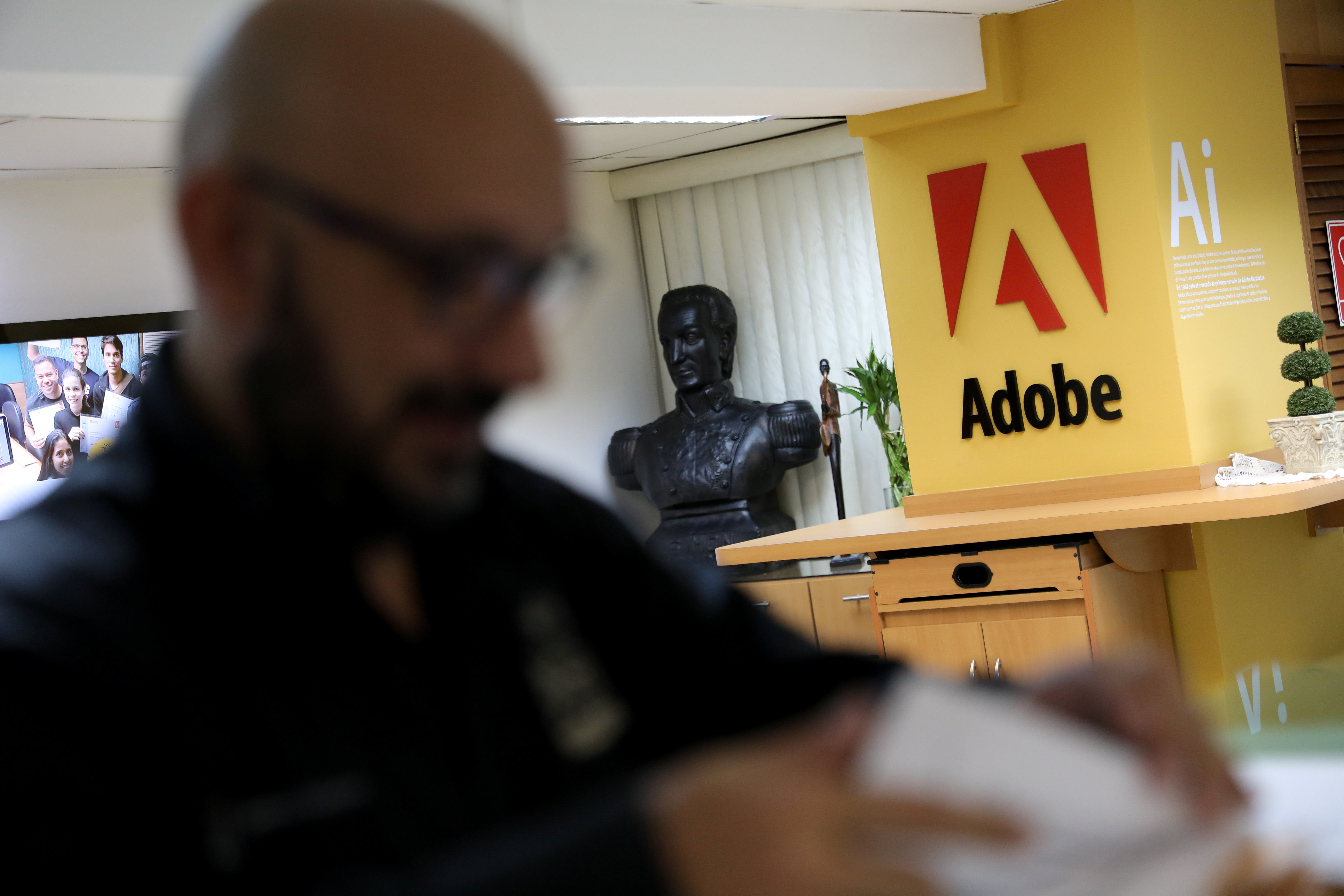 The corporate logo of software company Adobe is on display at the Posa Studio school in Caracas