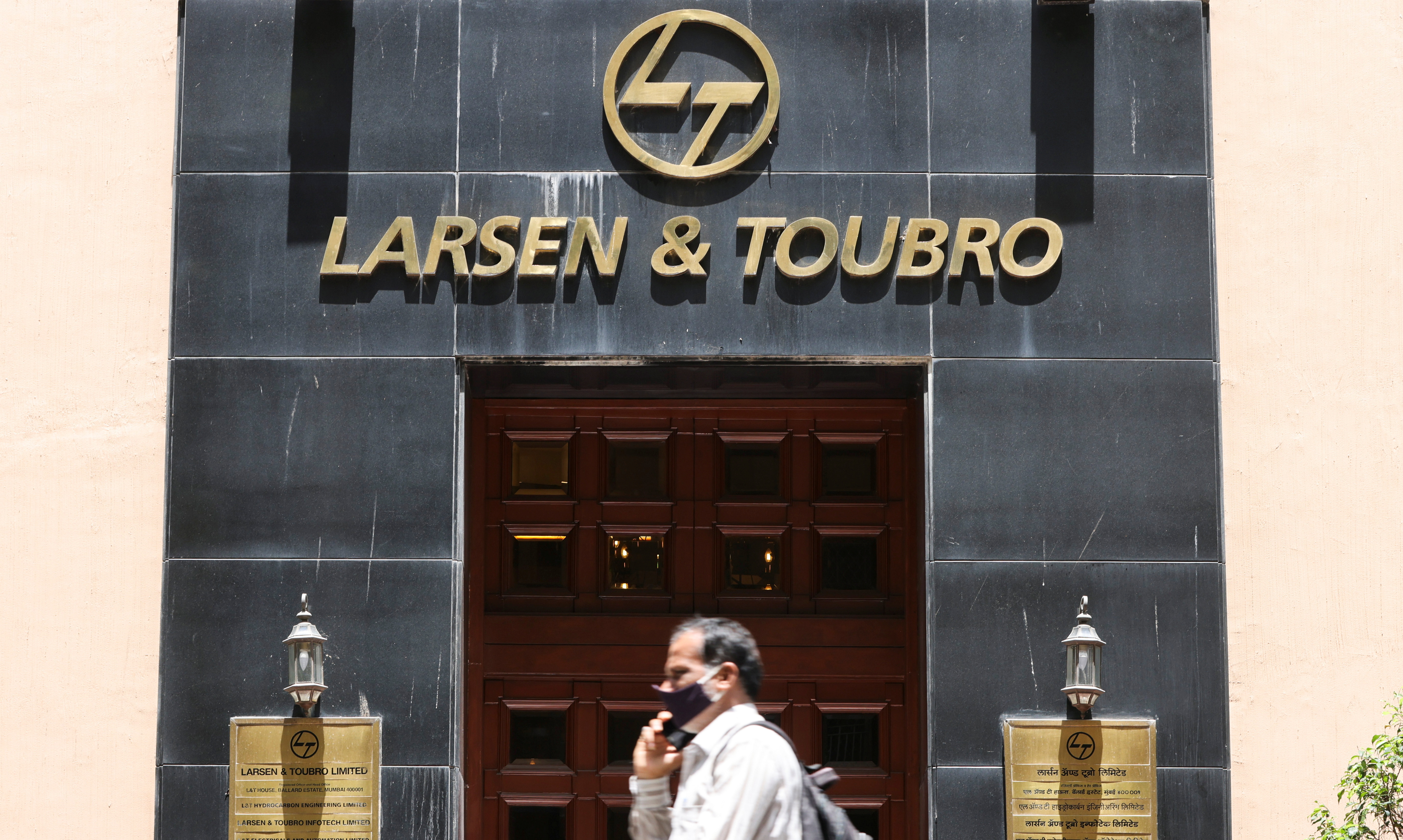 A man walks past the Larsen and Toubro (L&T) head office in Mumbai