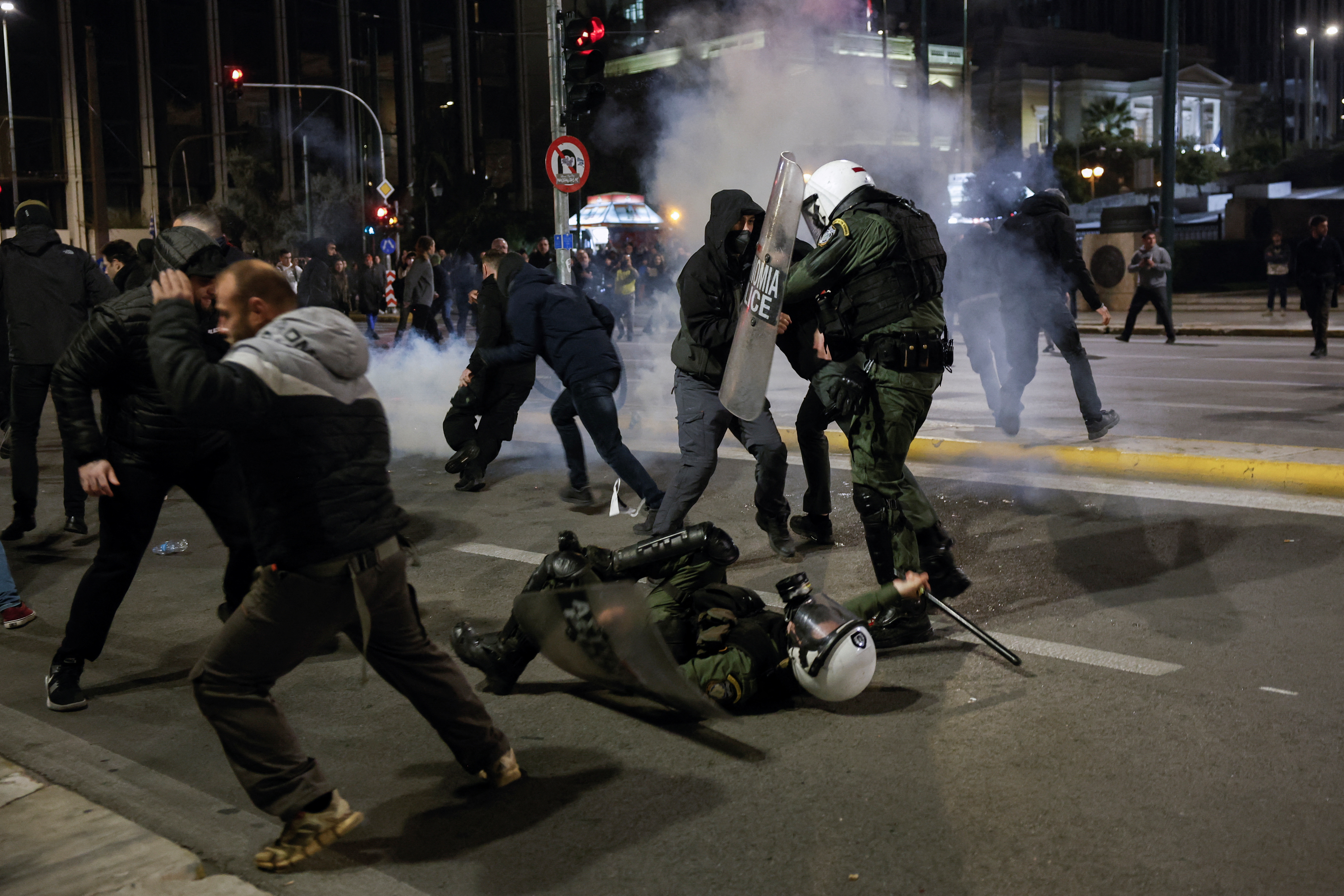 Demonstrators clash with police during a demonstration following a train accident near the city of Larissa in Athens