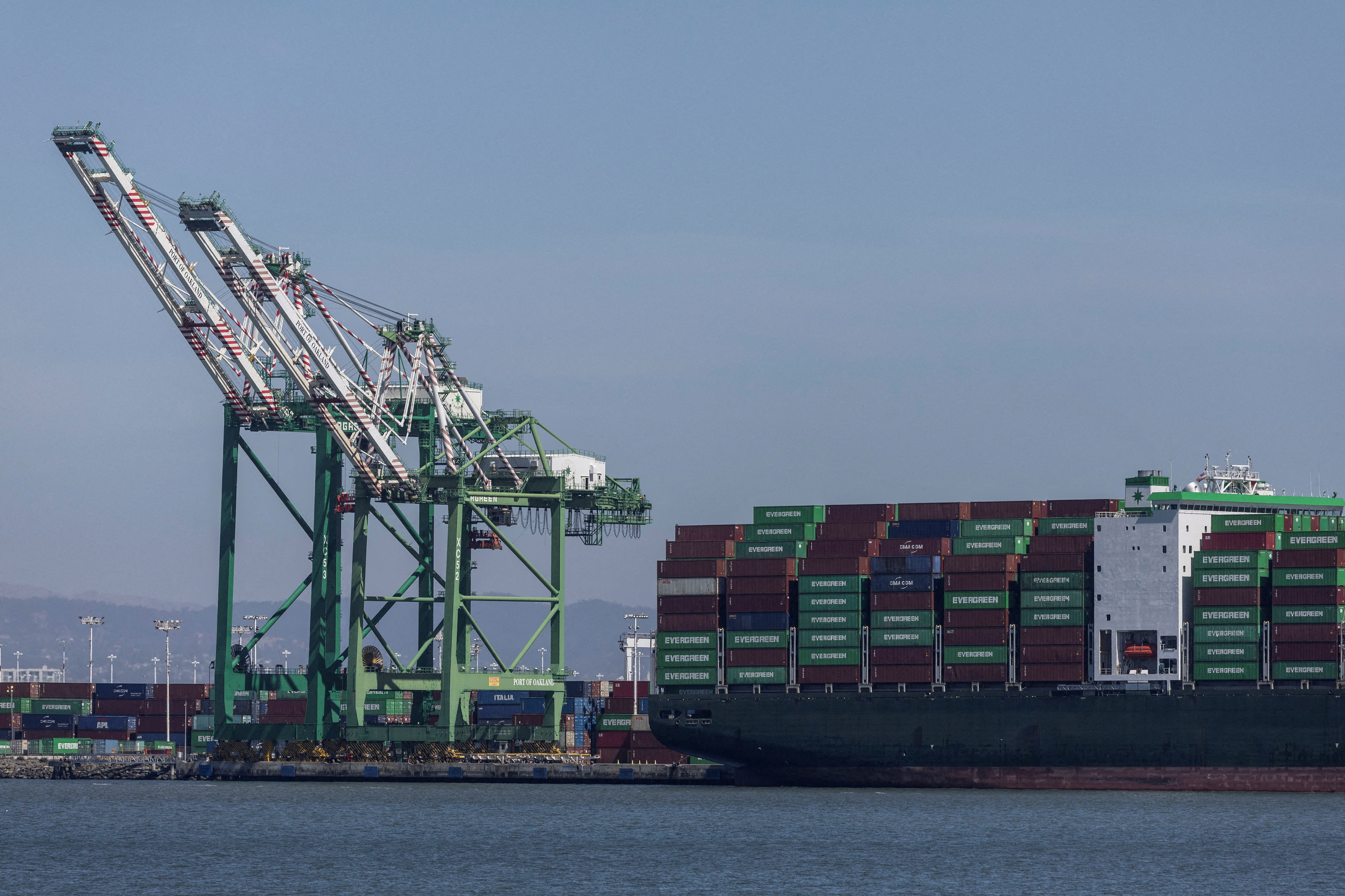 A cargo ship is seen near the port of Oakland, California
