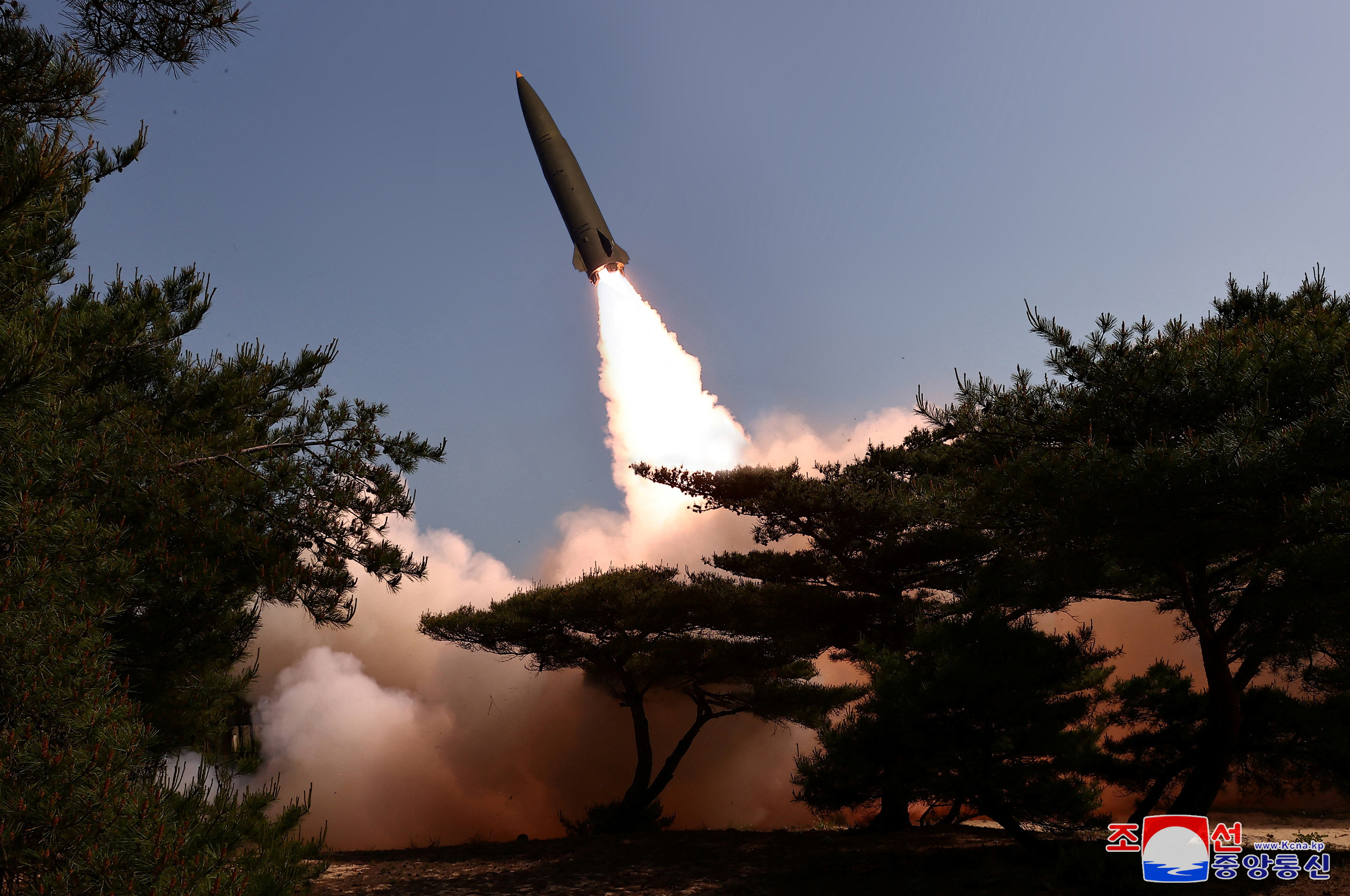 A missile is launched, as North Korea conducted a test firing of a tactical ballistic missile on Friday,