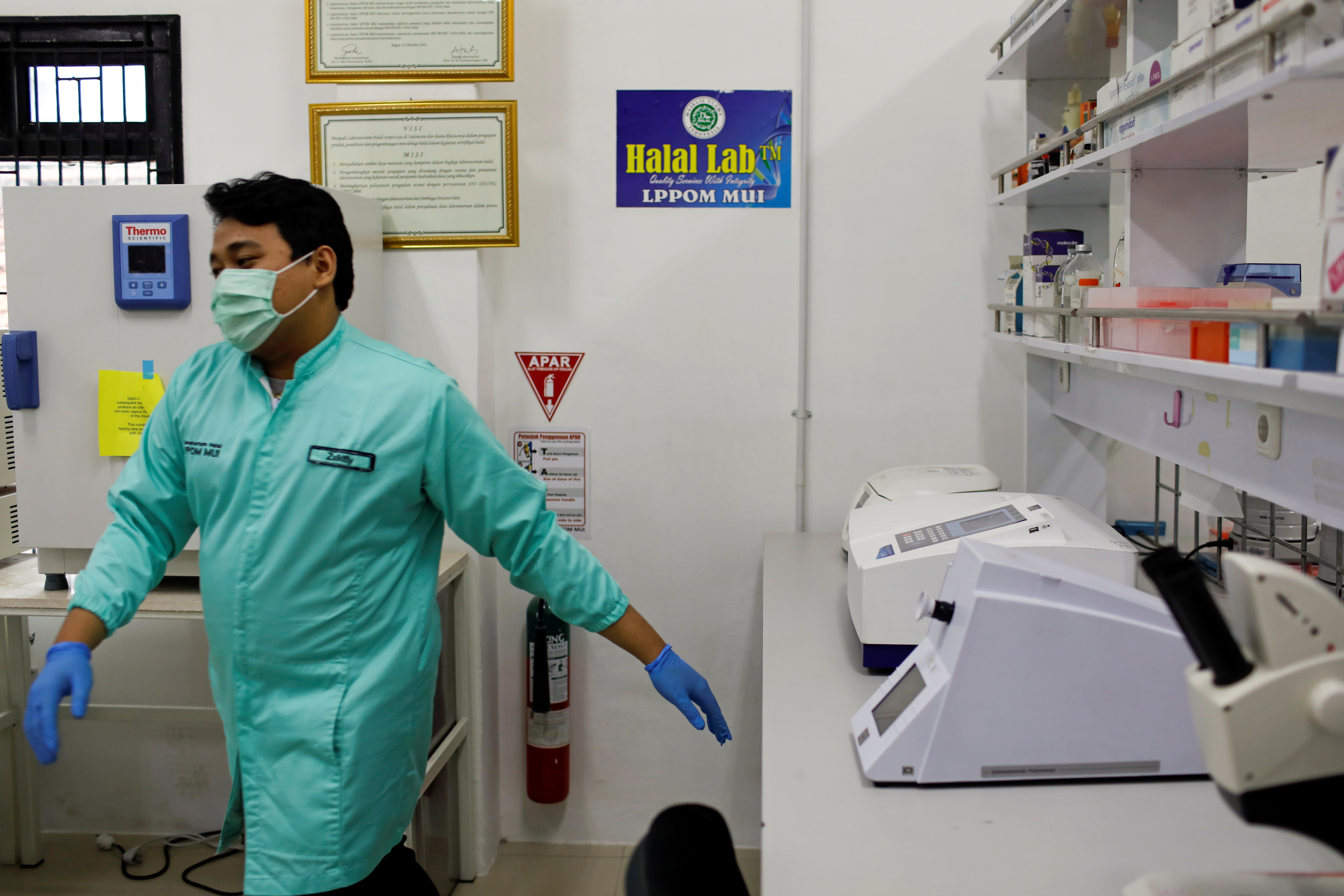 Analyst walks inside a laboratorium of Global Halal Centre, in Bogor