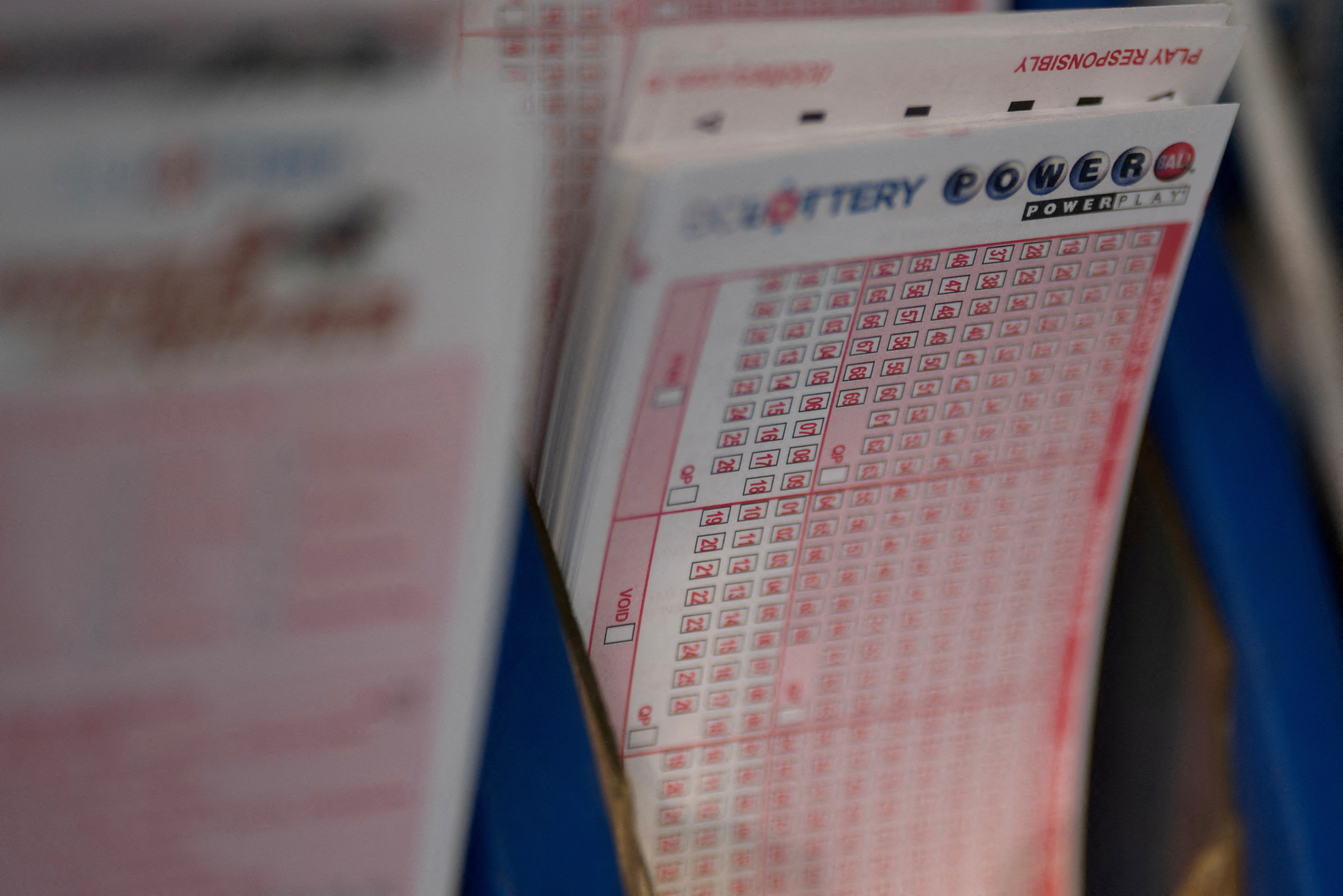 Powerball tickets are seen at a liquor store, in Washington
