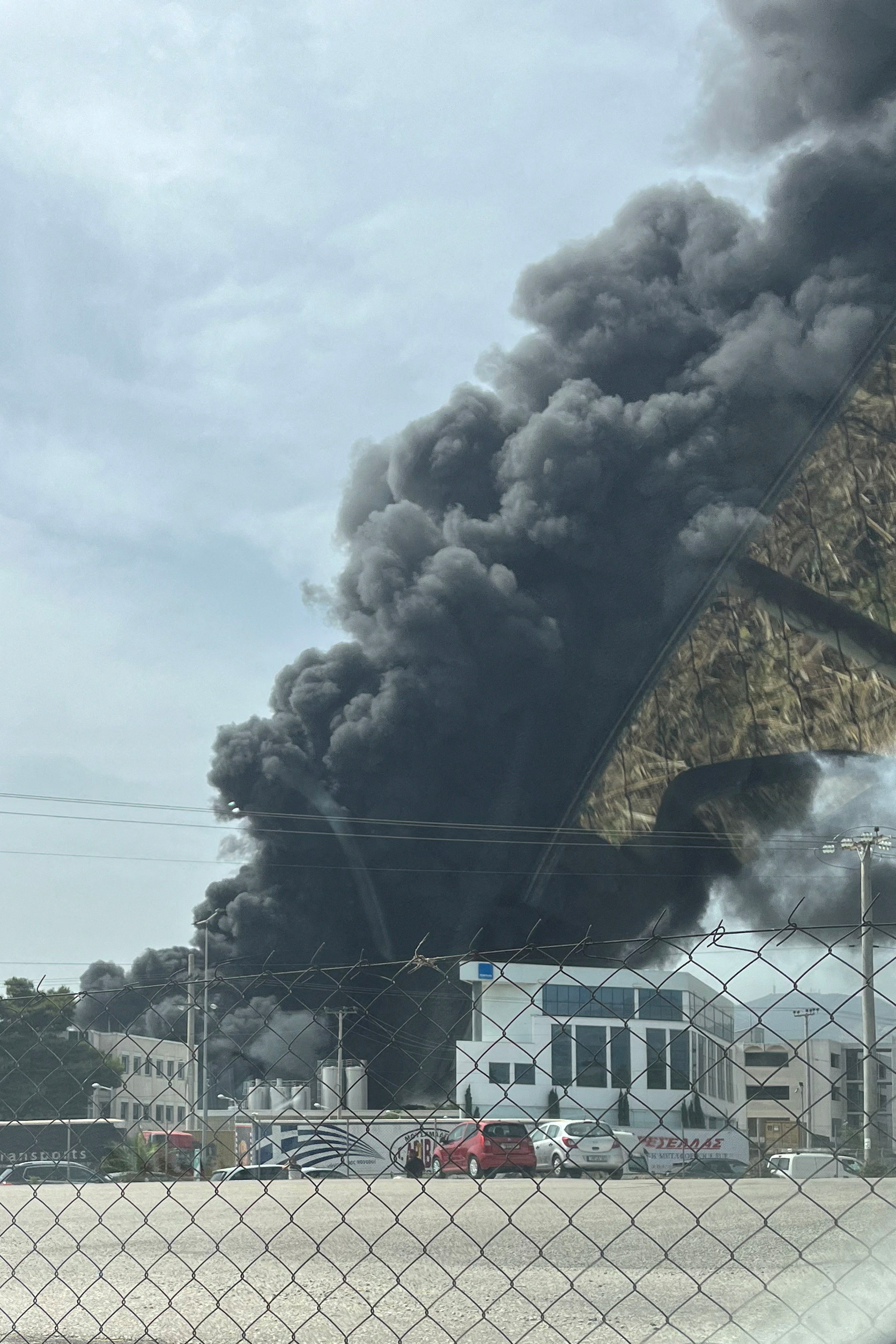 Fire rages at a cookware factory burns in Athens