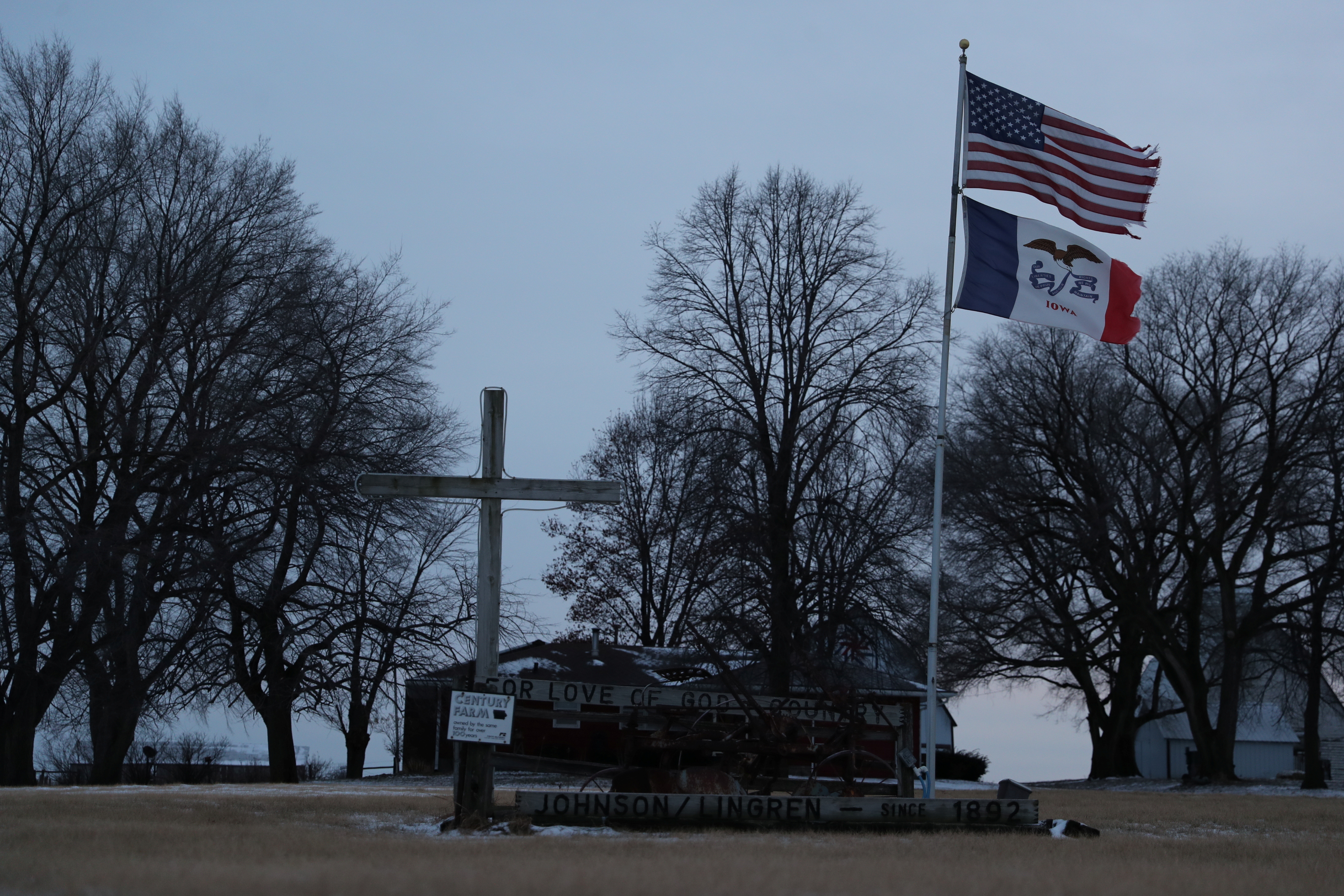 A cross and flags are seen near Ogden Adel