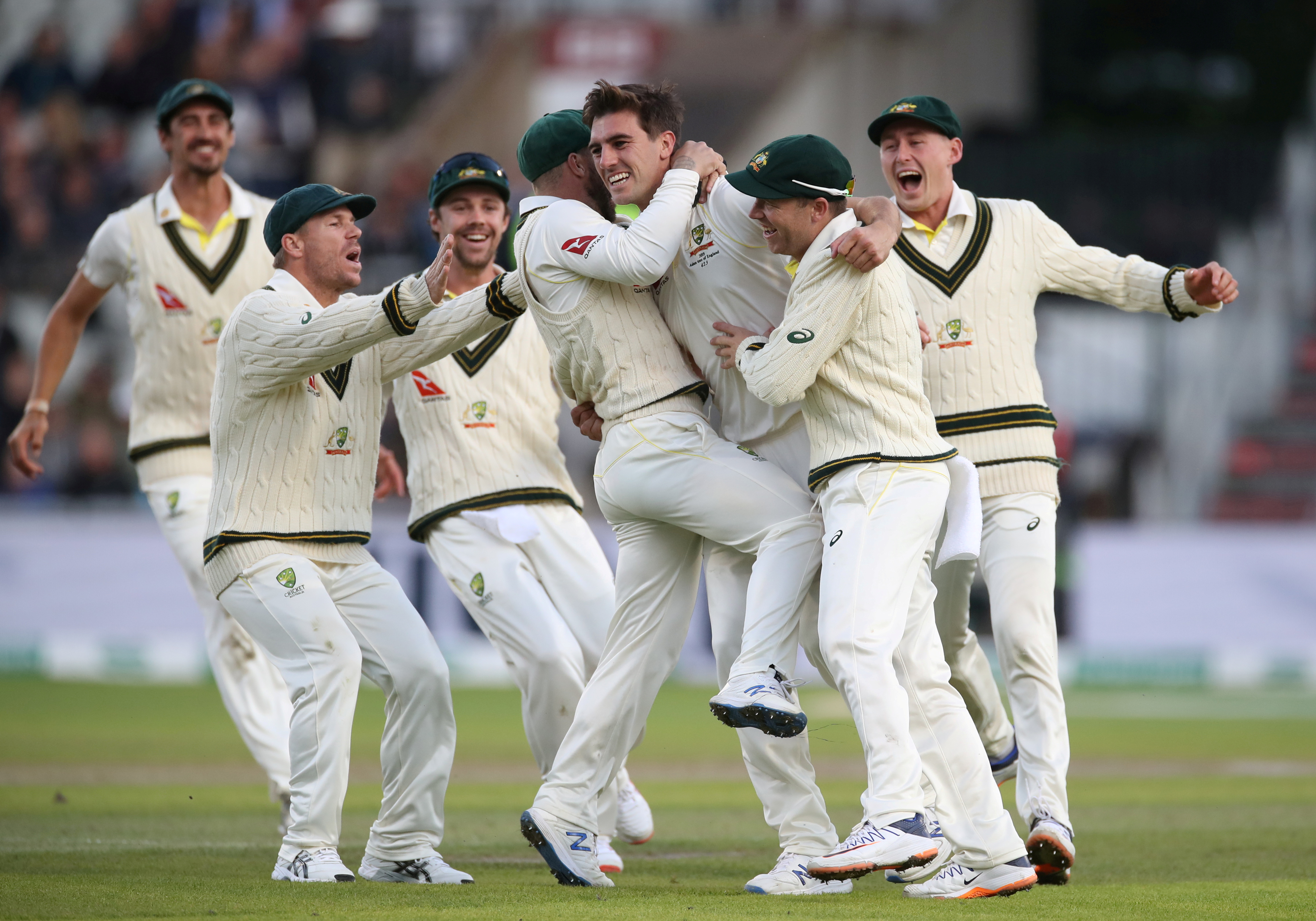 Cricket - Ashes 2019 - Fourth Test - England v Australia - Emirates Old Trafford, Manchester, Britain - September 7, 2019   Australia's Pat Cummins celebrates taking the wicket of England's Joe Root with team mates.  Action Images via Reuters/Carl Recine