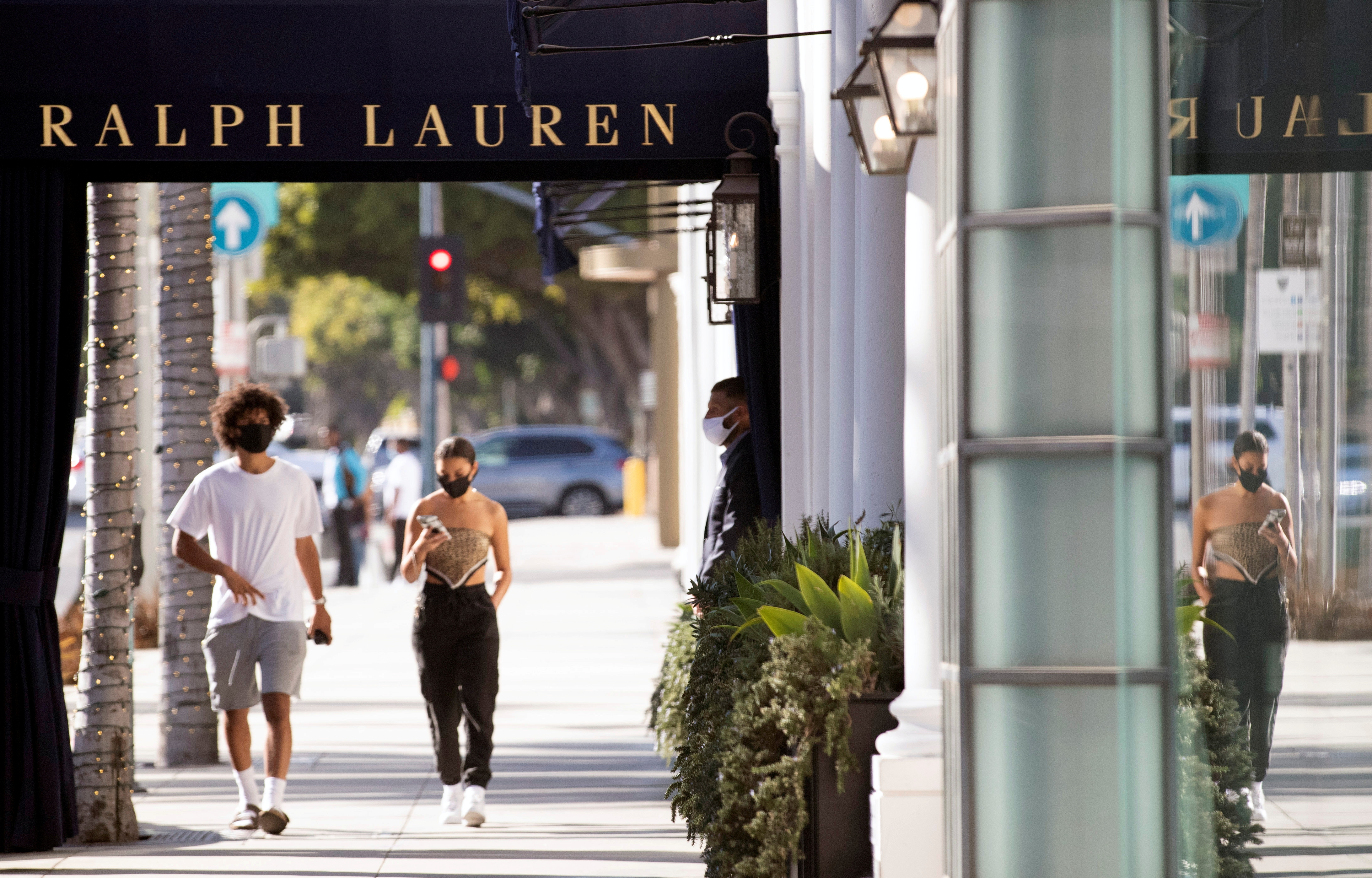 A security guard stands outside the Ralph Lauren store during the outbreak of the coronavirus disease (COVID-19), in Beverly Hills