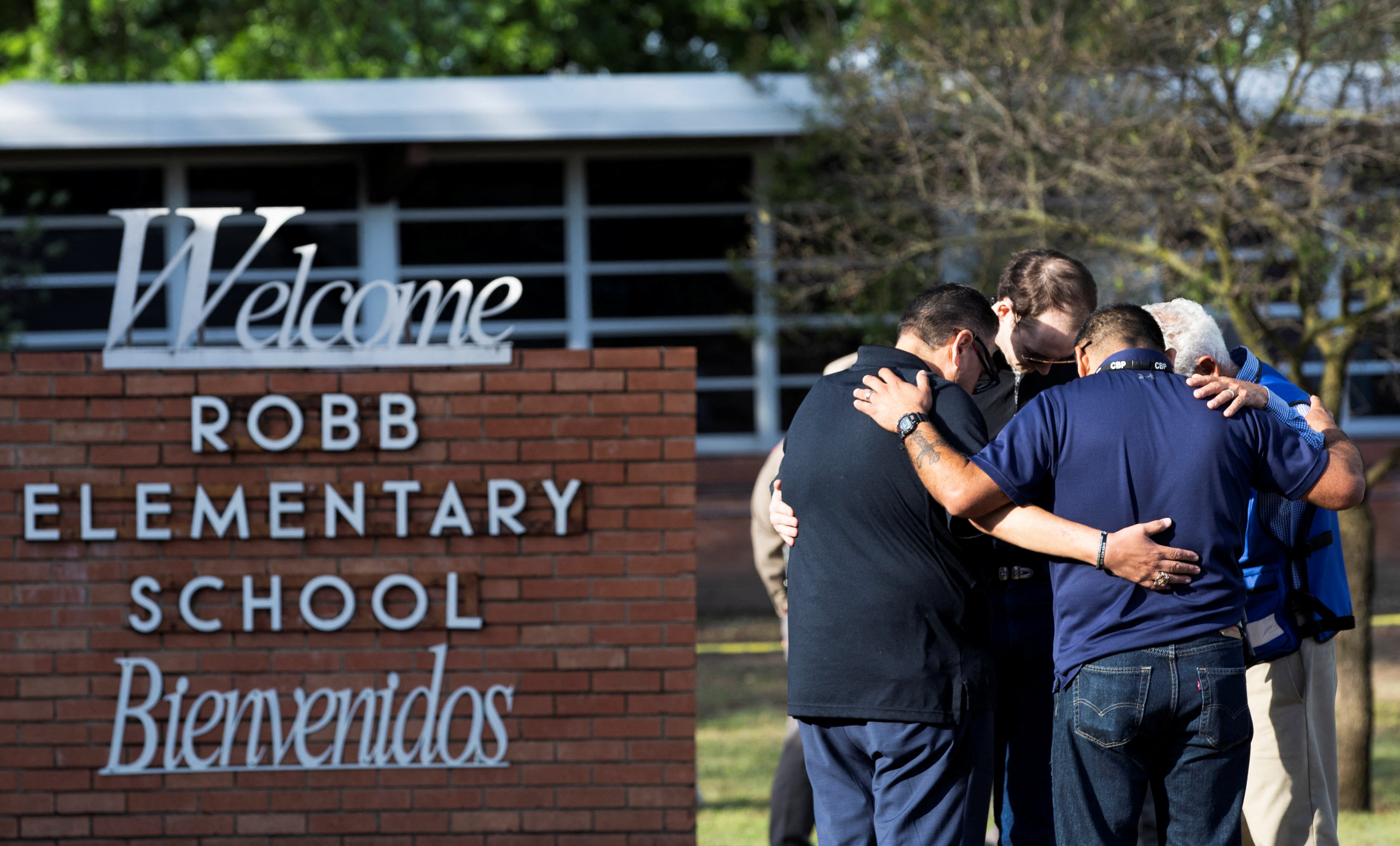 People react after a mass shooting at Robb Elementary School in Uvalde