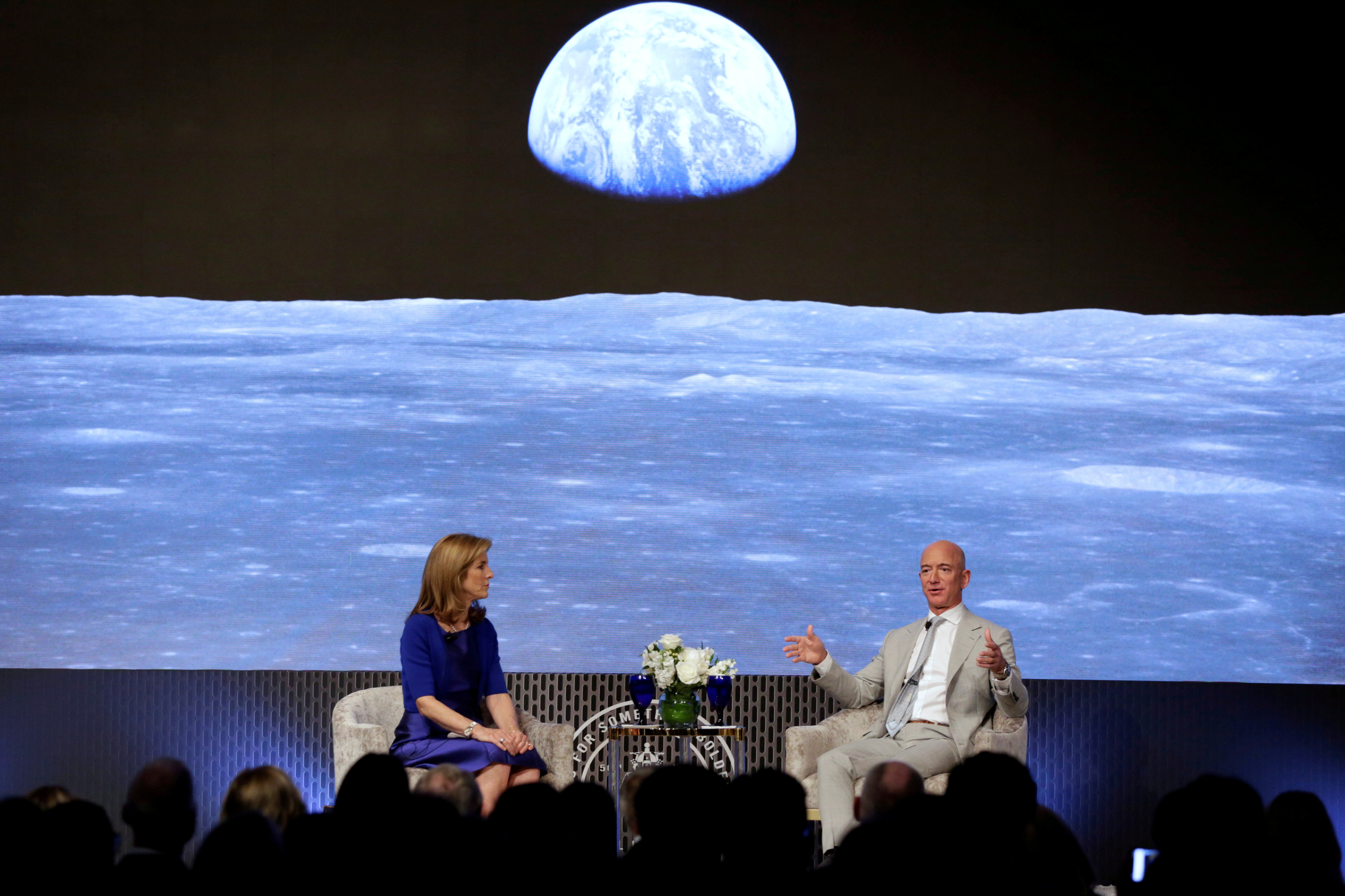 Jeff Bezos speaks with Caroline Kennedy in 2019 at moon landing anniversary event