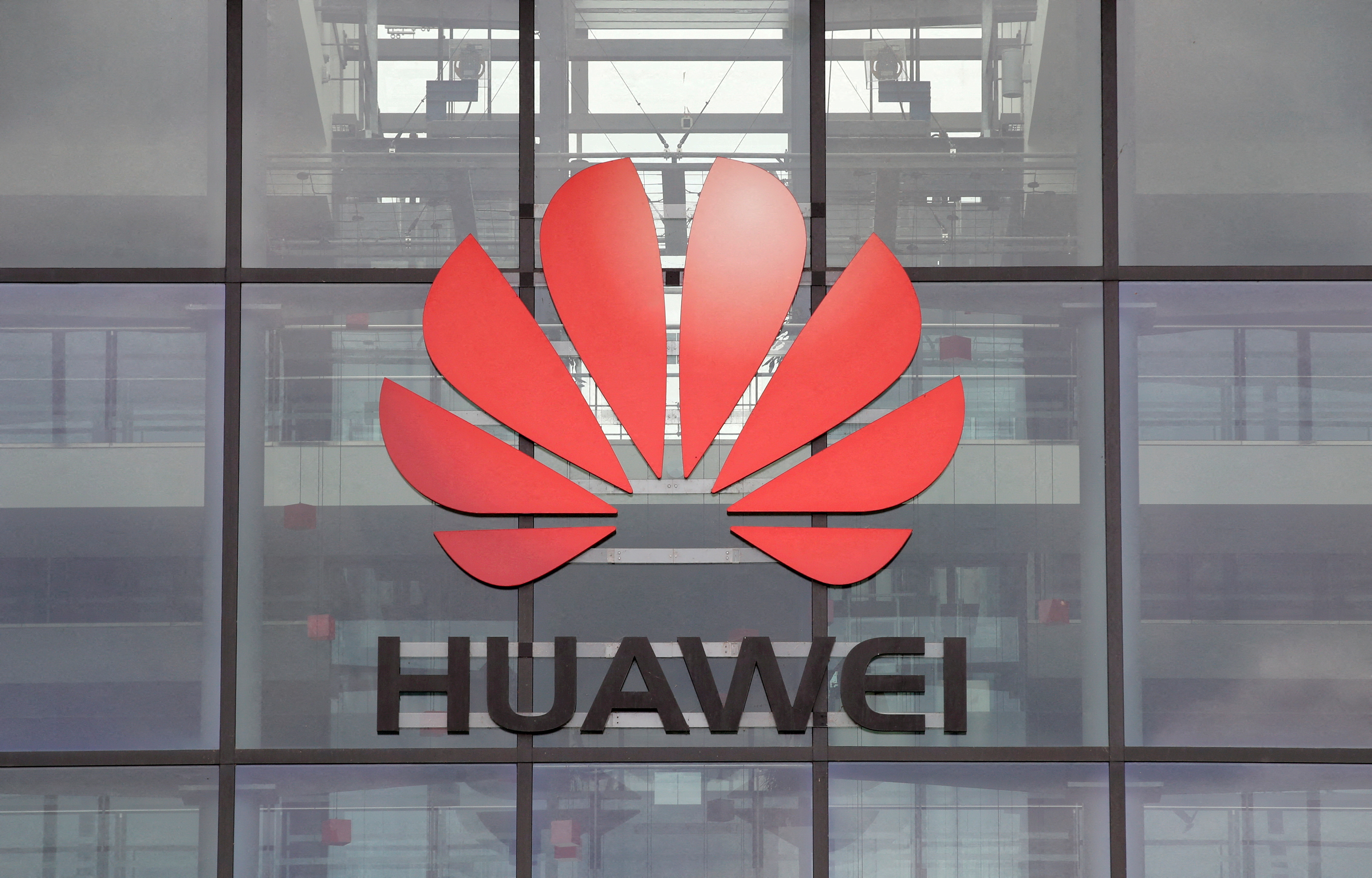 Huawei logo is pictured on its headquarters building in Reading, Britain